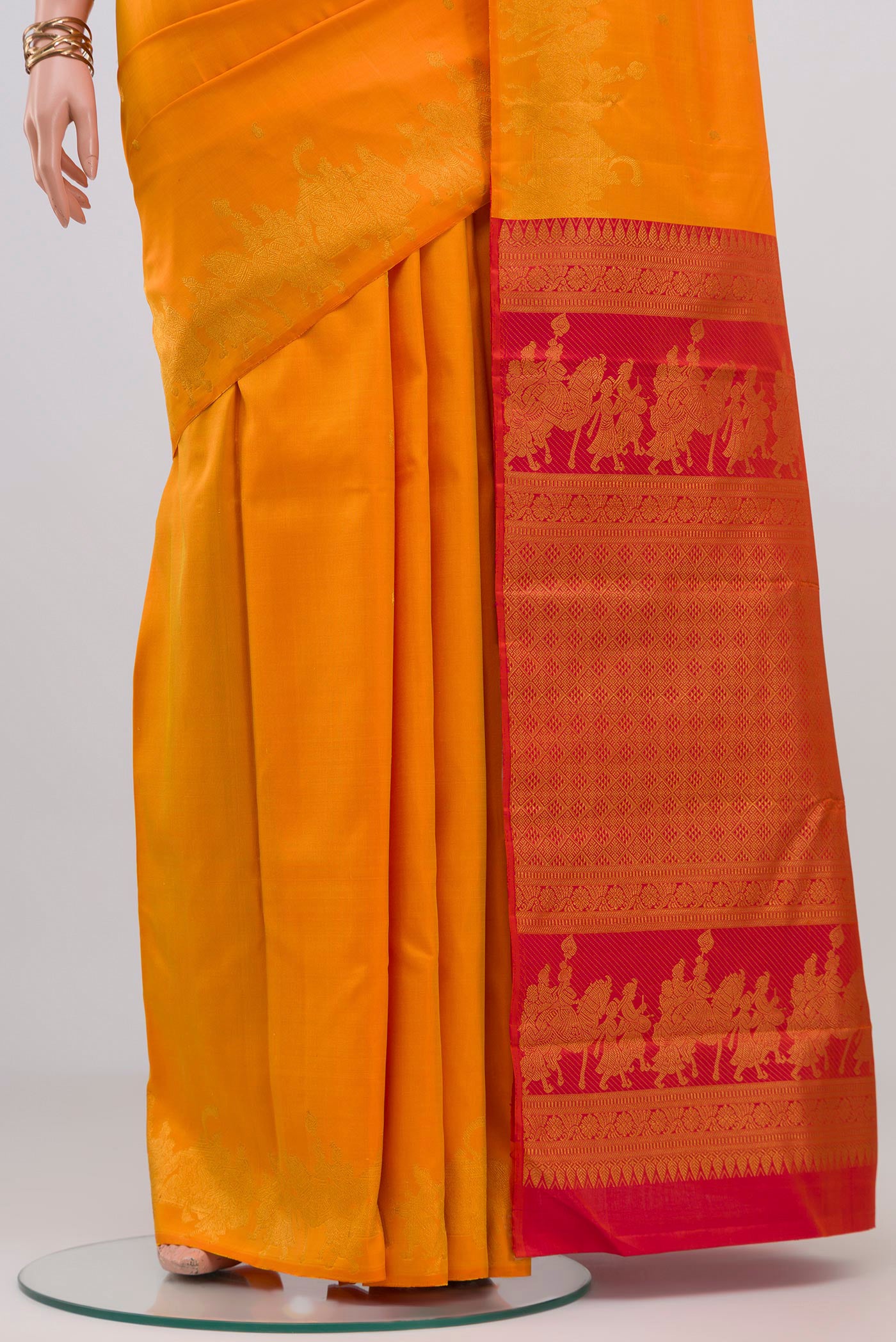 Pleats and pallu of Pure Silk Pure Zari Yellow Kanjivaram Saree with Zari Butta on the body and Fancy Border. 