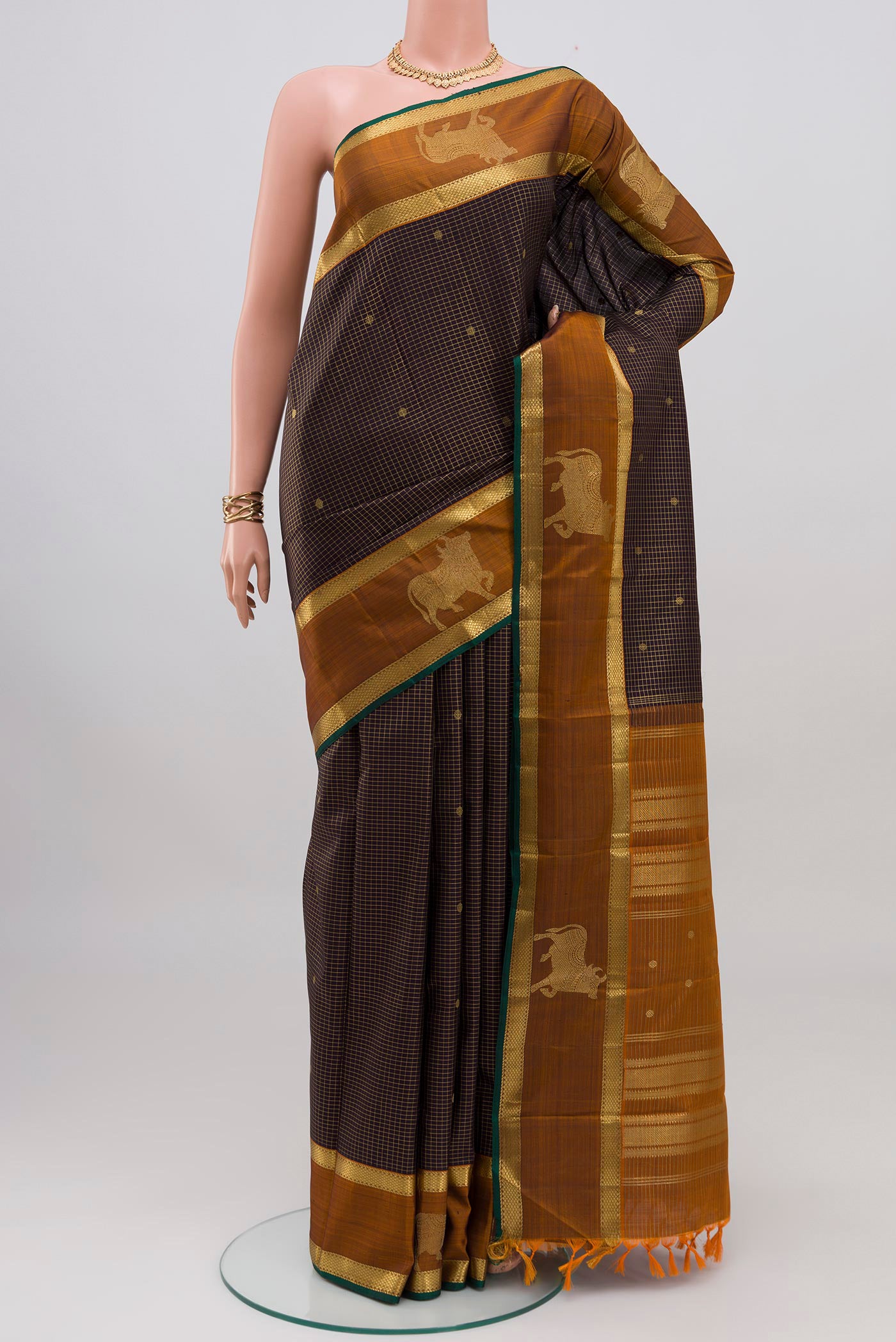 Coffee Brown Kanchipuram Silk Saree with Checked design on the body and Zari Border.  displayed on a mannequin