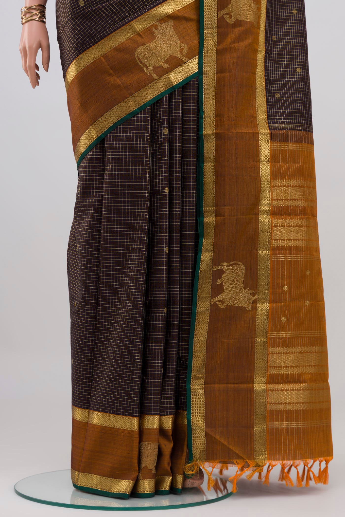 Pleats and pallu of Coffee Brown Kanchipuram Silk Saree with Checked design on the body and Zari Border. 
