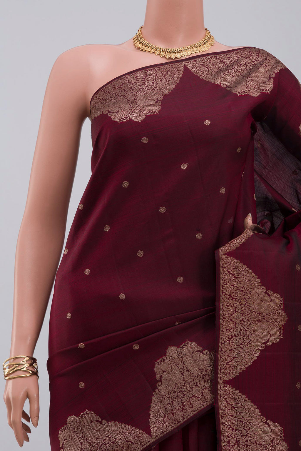 Border image of Pure Silk Pure Zari Maroon Kanjivaram Saree with Zari Butta on the body and Fancy Border. 