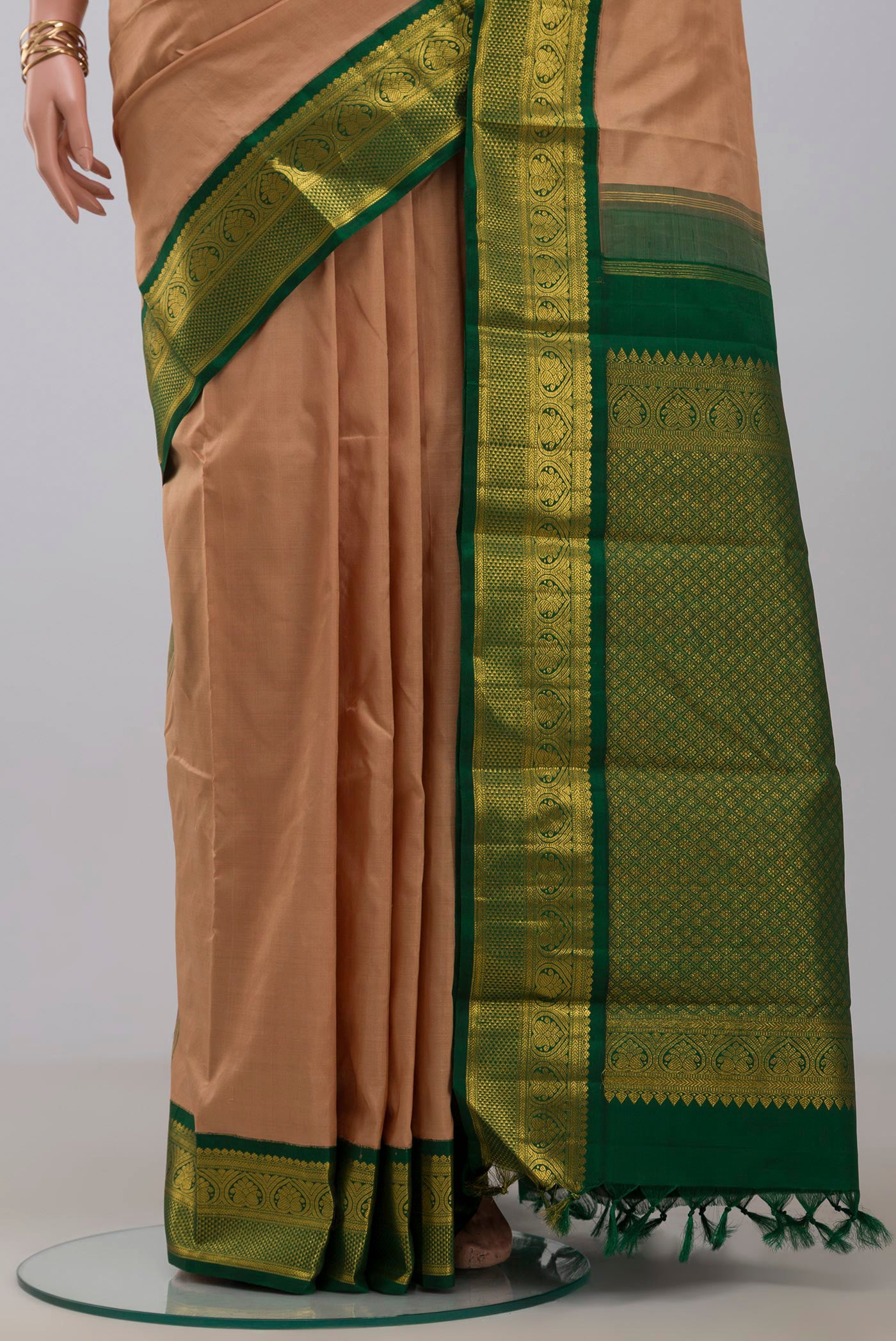 Pleats and pallu of Pure Silk Pure Zari Beige Kanjivaram Saree with Plain Body and Zari Border. 