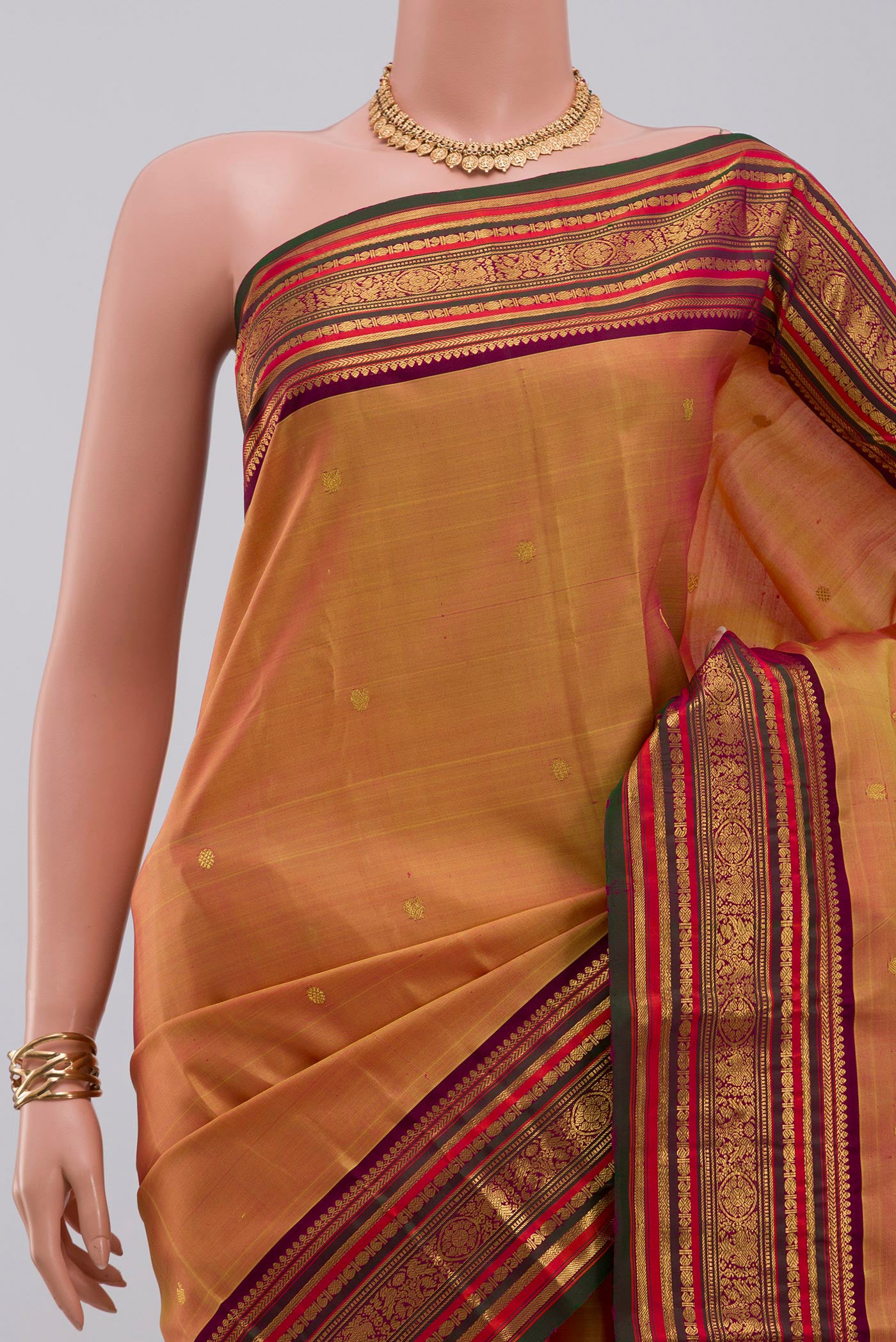 Border image of Mustard Kanjivaram Silk Saree with Zari Butta on the body and Zari Border. 