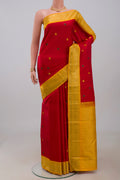 Pure Silk Pure Zari Red Kanjivaram Saree with Thread Butta on the body and Zari Border.  displayed on a mannequin