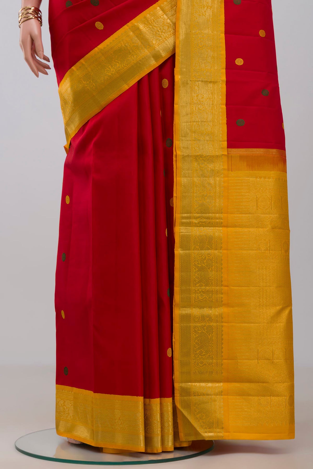Pleats and pallu of Pure Silk Pure Zari Red Kanjivaram Saree with Thread Butta on the body and Zari Border. 
