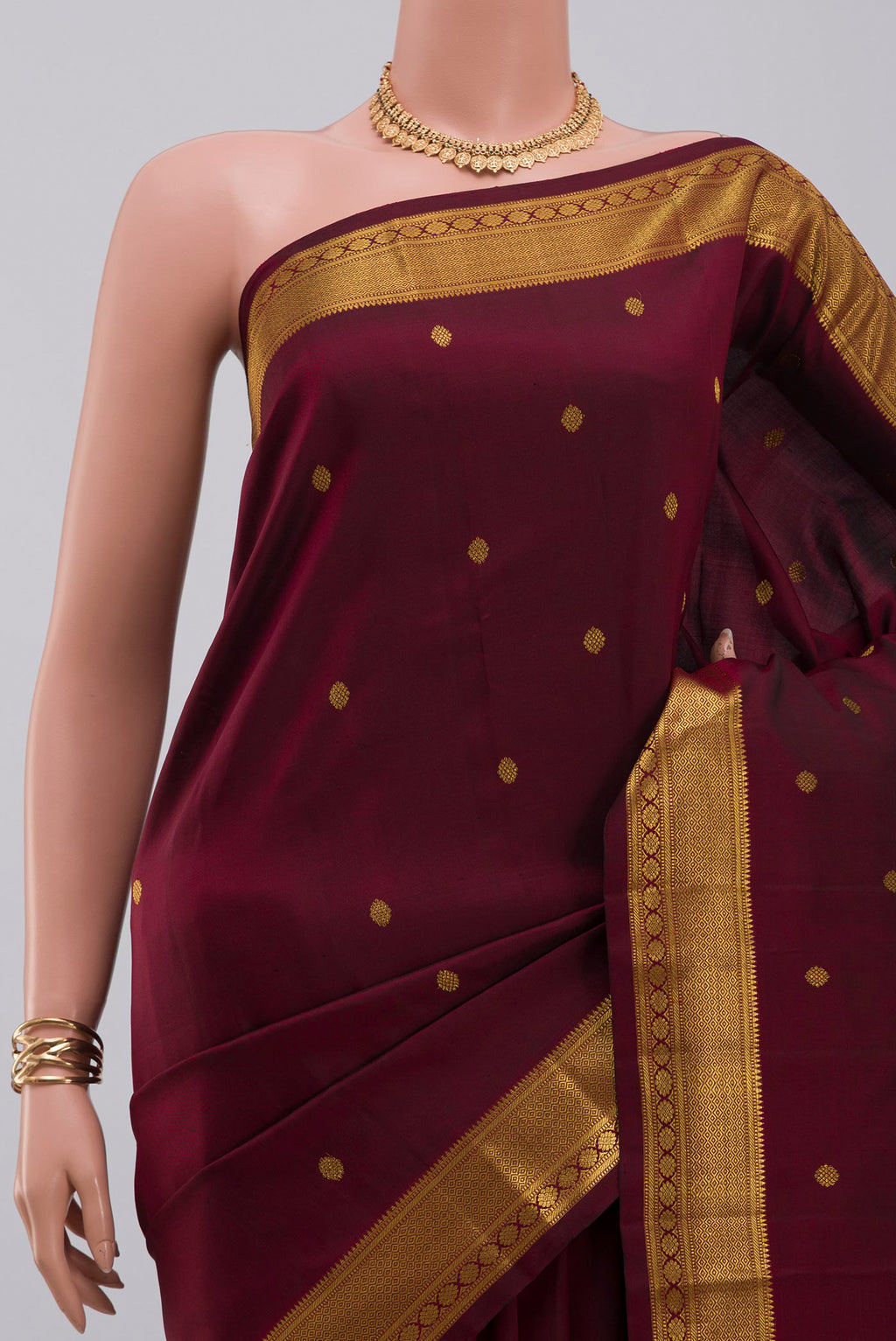 Border image of Pure Silk Pure Zari Maroon Kanchipuram Saree with Zari Butta on the body and Zari Border. 