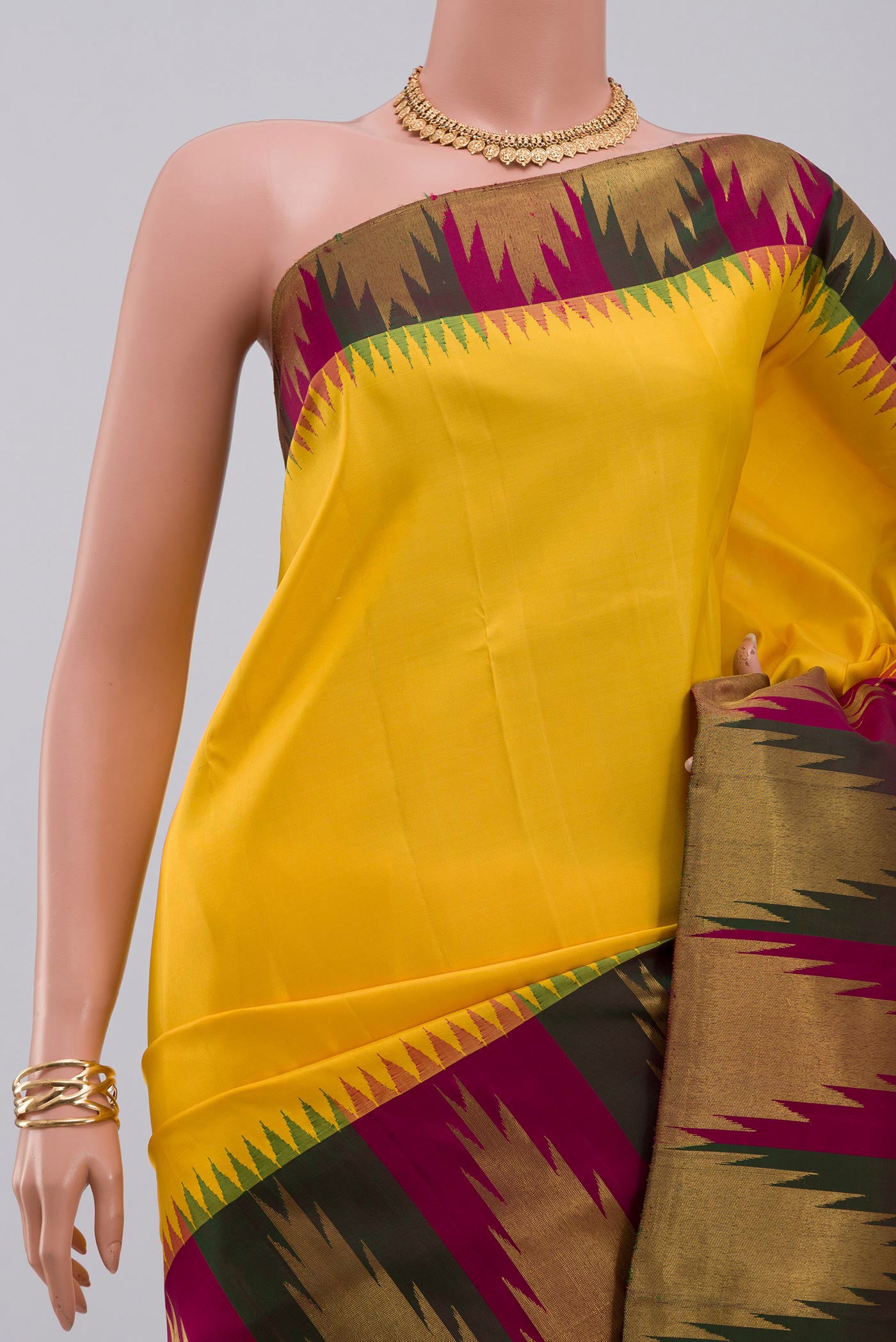 Border image of Pure Silk Pure Zari Yellow Kanjivaram Saree with Plain Body and Temple Border. 