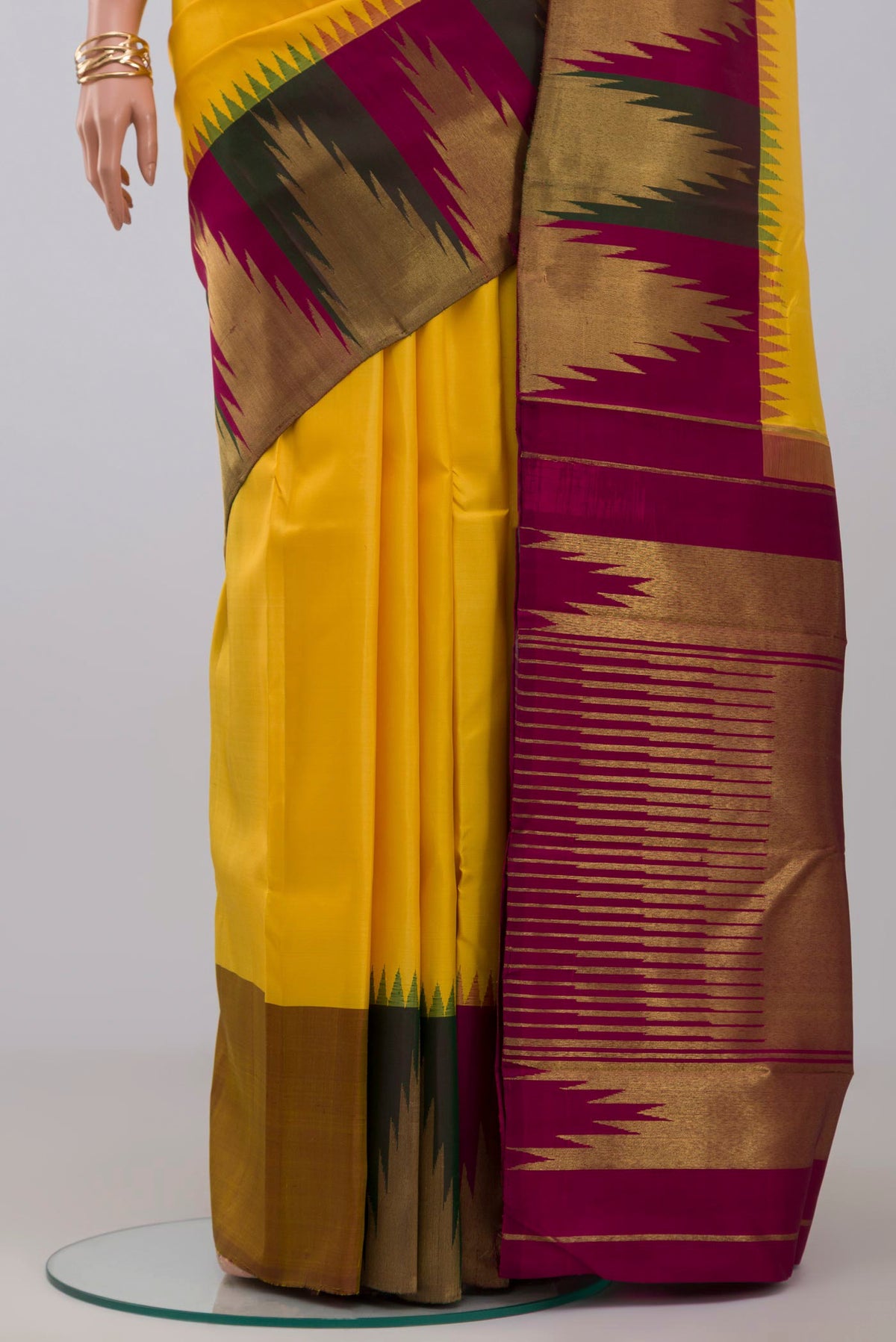 Pleats and pallu of Pure Silk Pure Zari Yellow Kanjivaram Saree with Plain Body and Temple Border. 