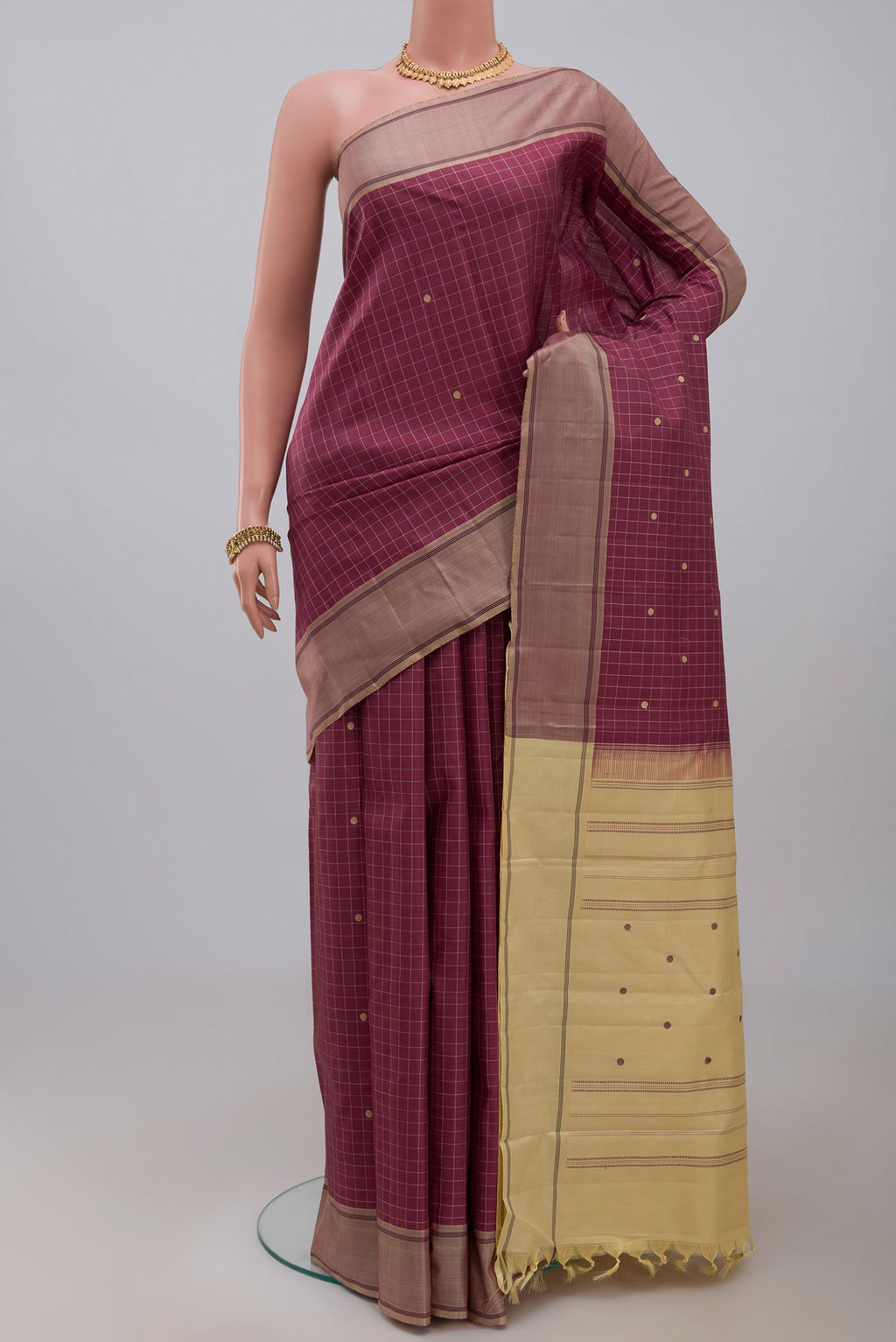 Pink Kanjivaram Saree with Checked design on the body and Plain Border.  displayed on a mannequin