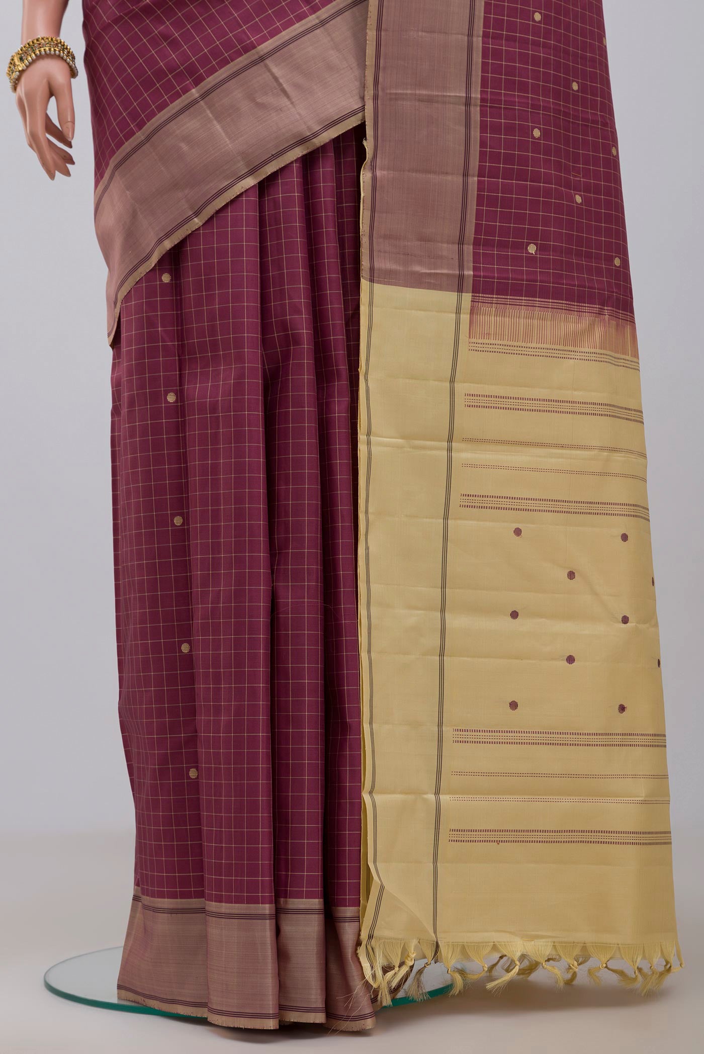 Pleats and pallu of Pink Kanjivaram Saree with Checked design on the body and Plain Border. 