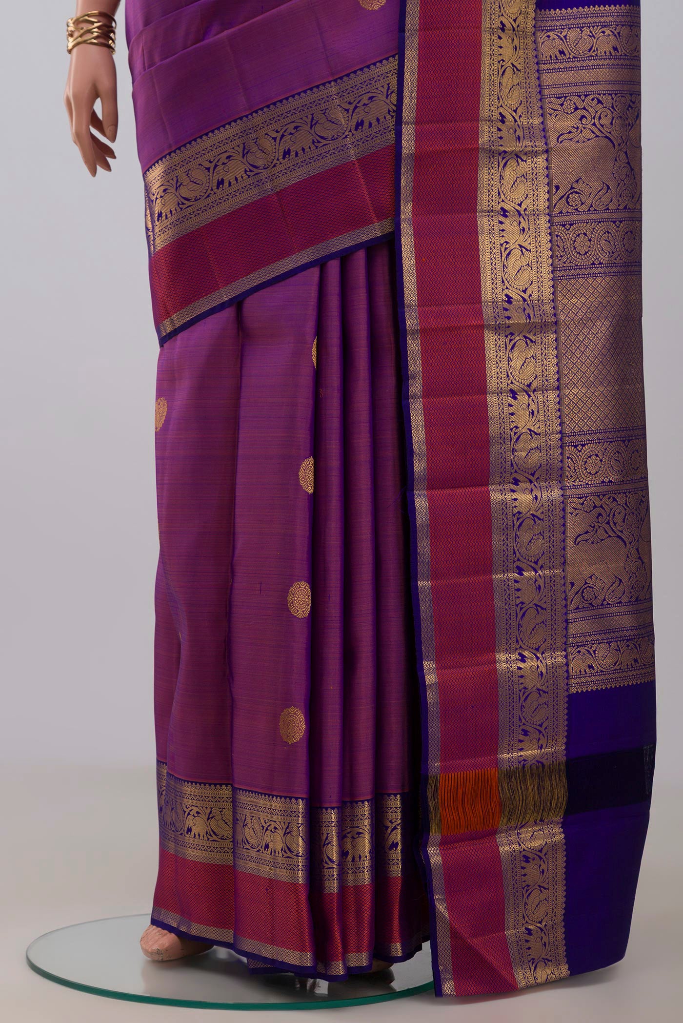 Pleats and pallu of Pure Silk Pure Zari Purple Kanjivaram Saree with Zari Butta on the body and Zari Border. 