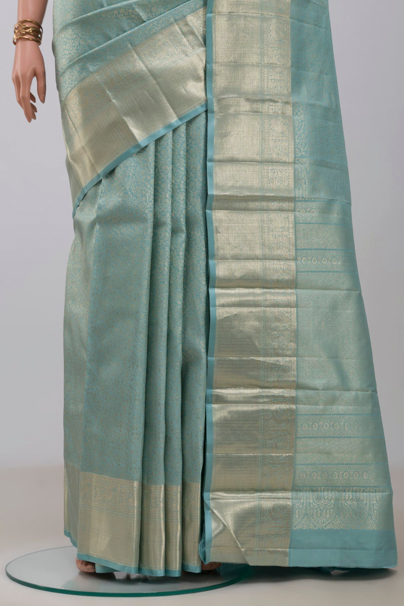 Pleats and pallu of Light Blue Kanchipuram Silk Saree with Zari Brocade on the body and Zari Border. 