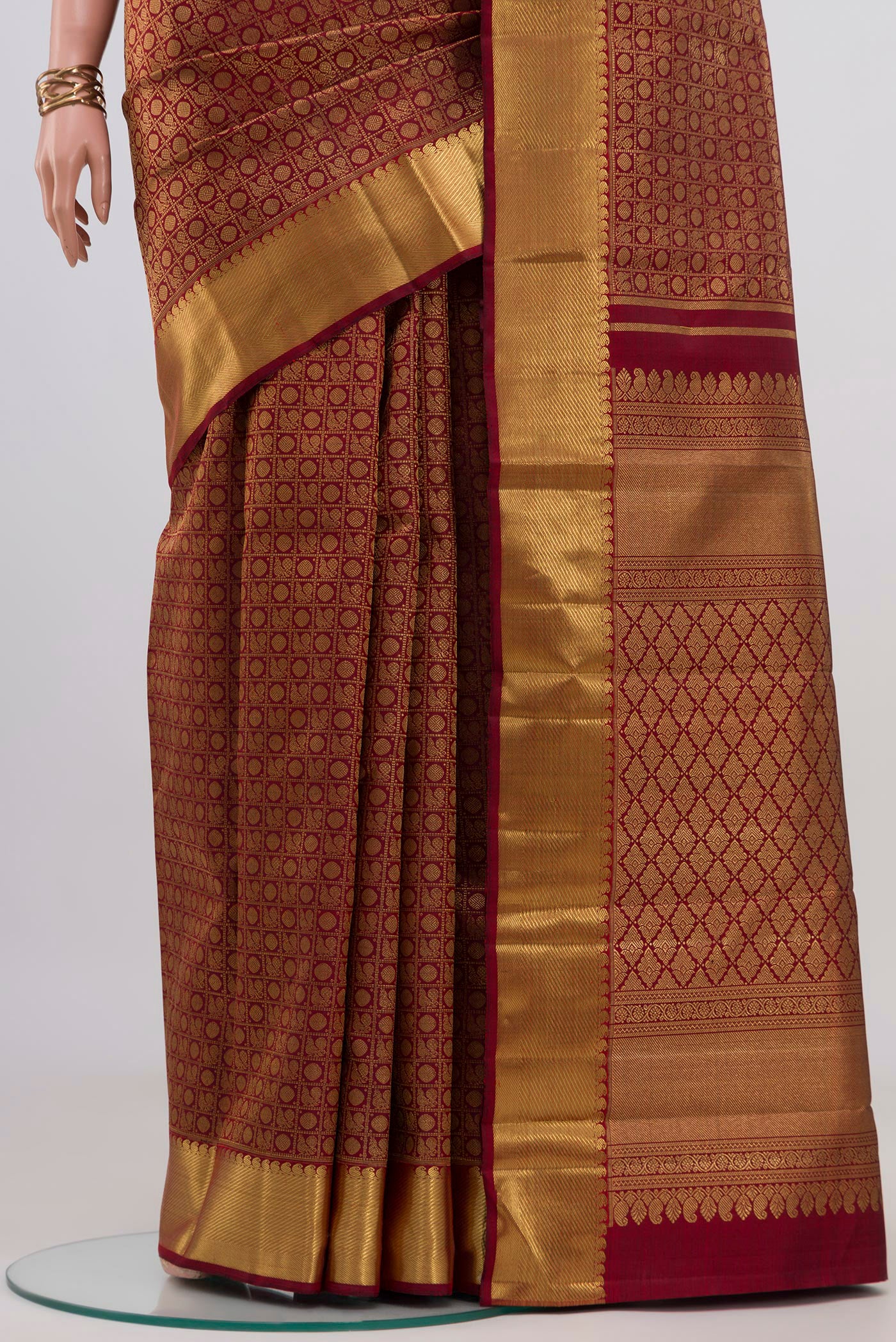 Pleats and pallu of Pure Silk Pure Zari Maroon Kanjivaram Saree with Zari Brocade on the body and Zari Border. 
