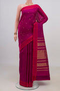 Pure Silk Magenta Kanchipuram Saree with Zari Butta on the body and Plain Border.  displayed on a mannequin
