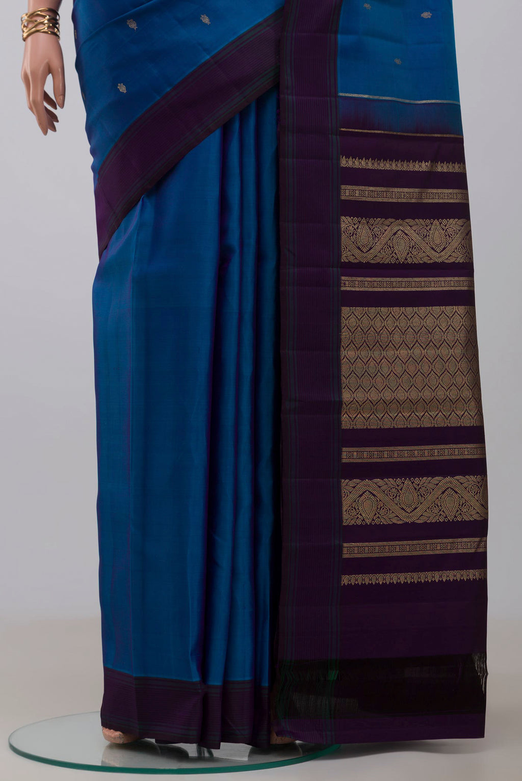 Pleats and pallu of Blue Kanchipuram Silk Saree with Zari Butta on the body and Plain Border. 