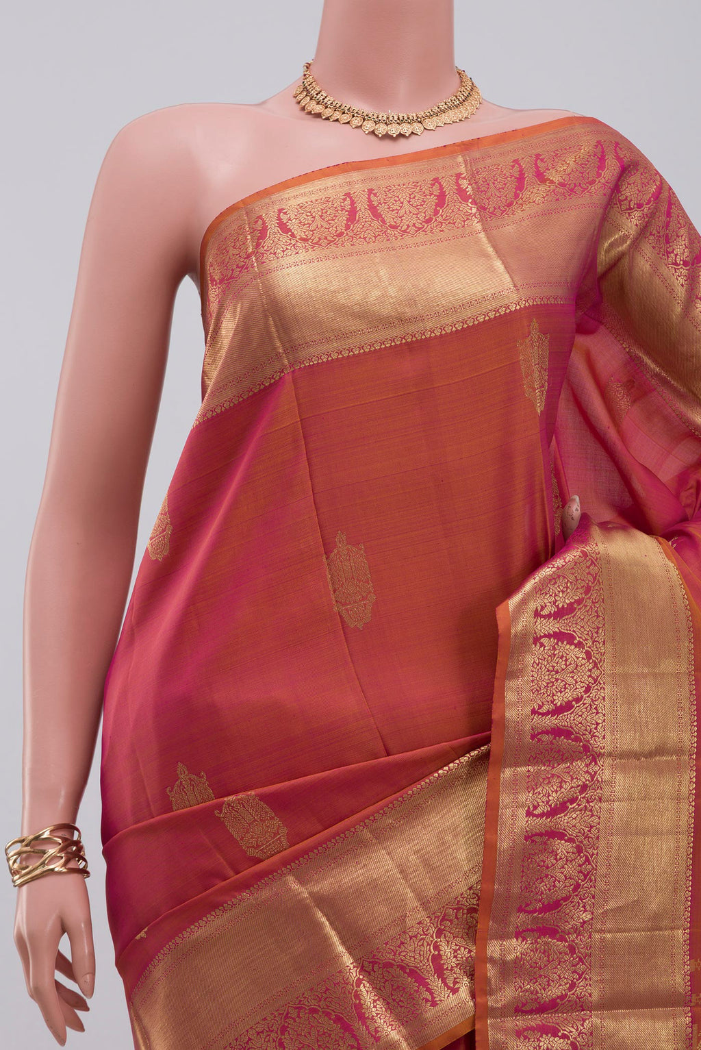 Border image of Orange Kanchipuram Silk Saree with Zari Butta on the body and Zari Border. 