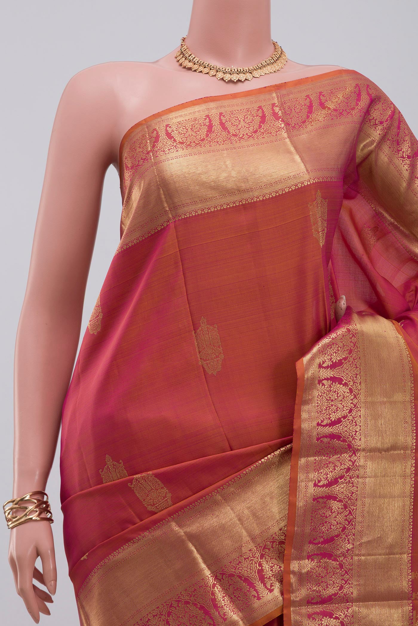 Border image of Orange Kanchipuram Silk Saree with Zari Butta on the body and Zari Border. 