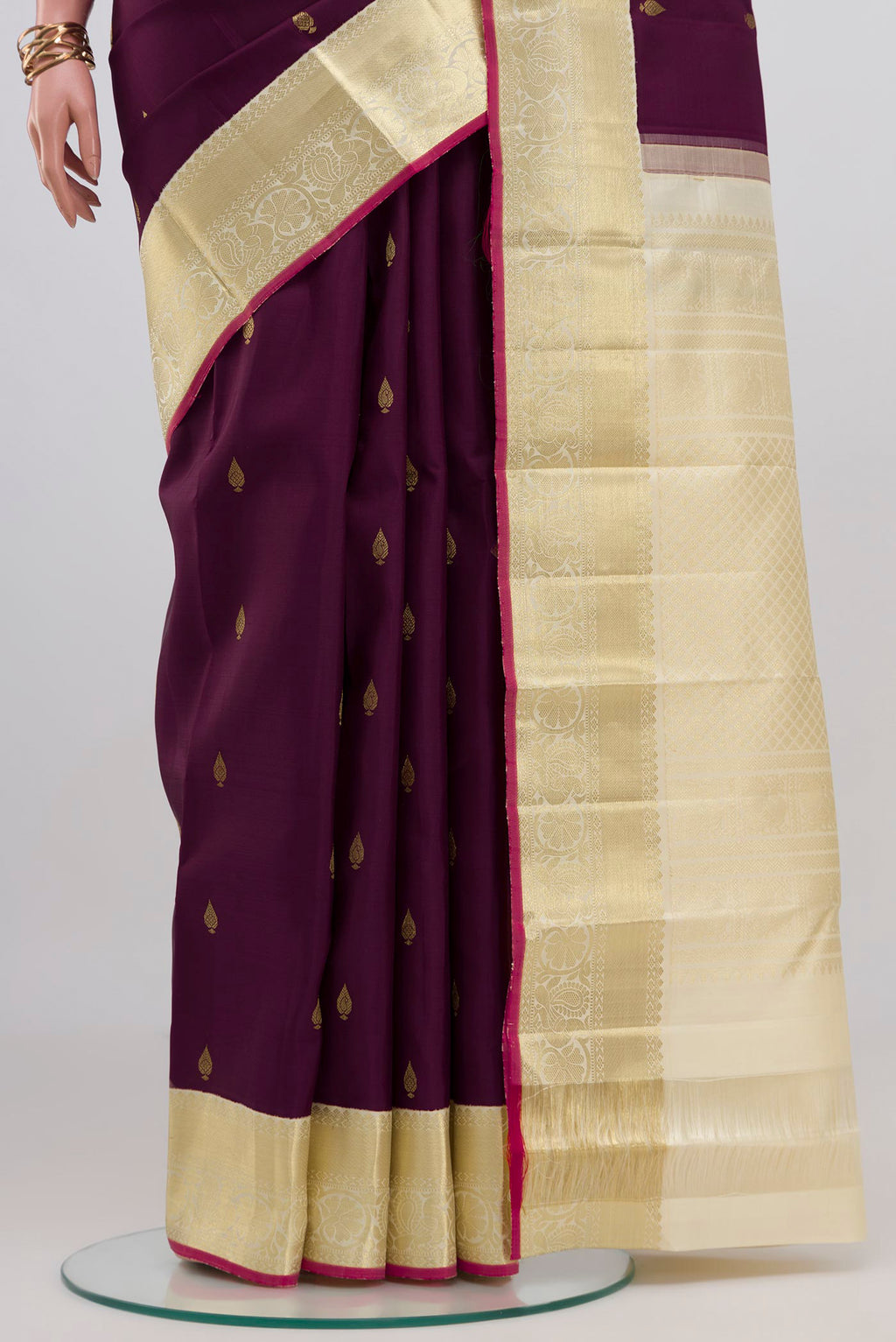 Pleats and pallu of Purple Kanjivaram Silk Saree with Zari Butta on the body and Zari Border. 