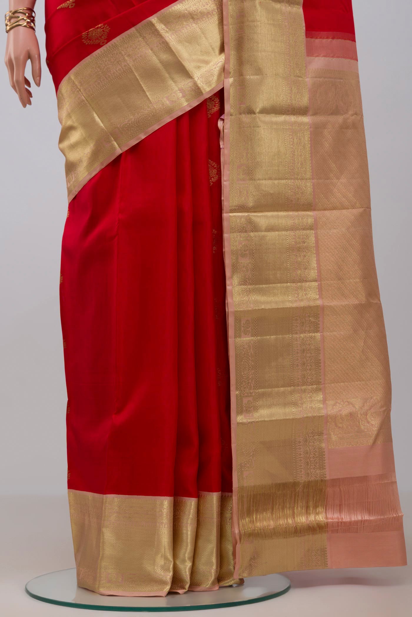 Pleats and pallu of Red Kanjivaram Silk Saree with Zari Butta on the body and Zari Border. 
