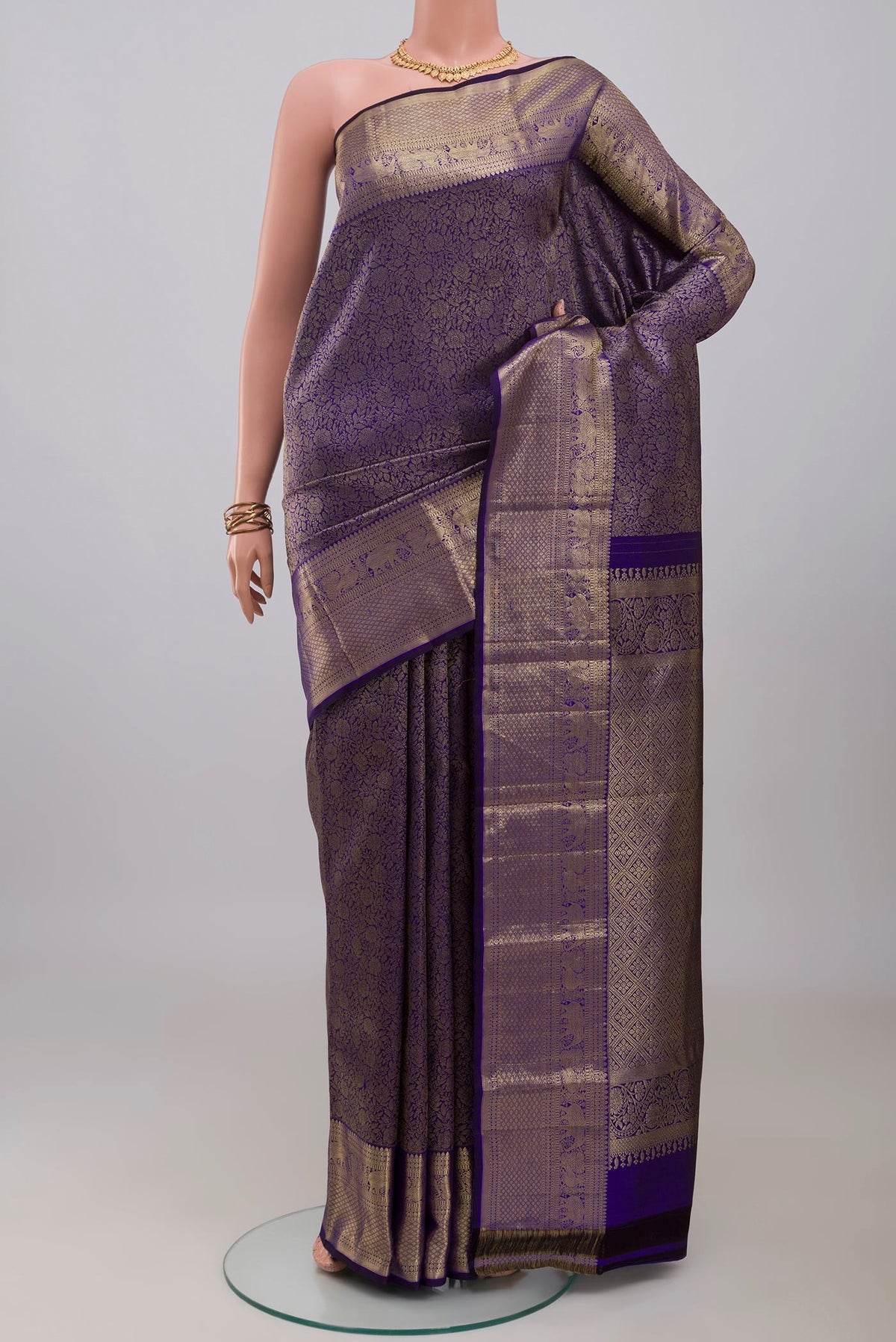 Blue Kanjivaram Silk Saree with Zari Brocade on the body and Zari Border.  displayed on a mannequin