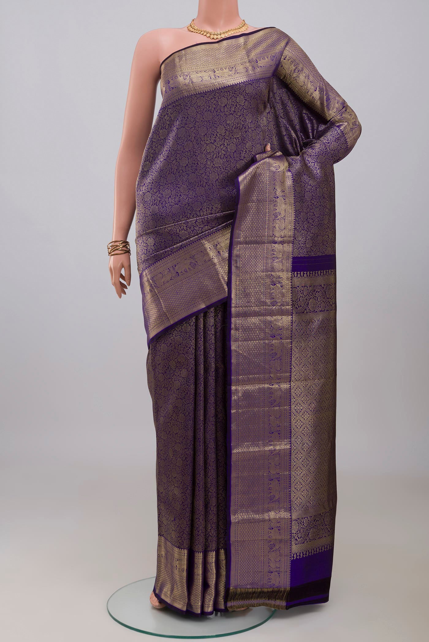 Blue Kanjivaram Silk Saree with Zari Brocade on the body and Zari Border.  displayed on a mannequin