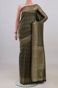 Pure Silk Bottle Green Kanjivaram Saree with Zari Brocade on the body and Zari Border.  displayed on a mannequin