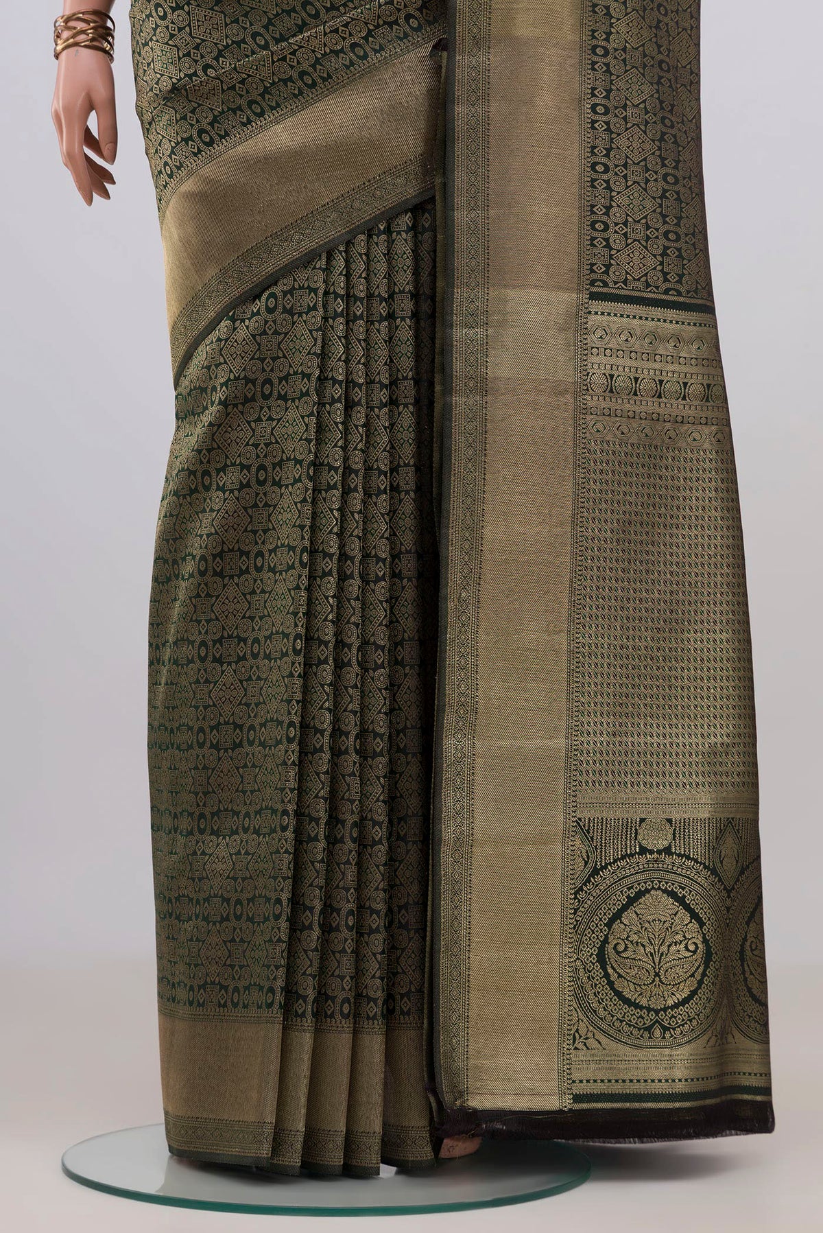 Pleats and pallu of Pure Silk Bottle Green Kanjivaram Saree with Zari Brocade on the body and Zari Border. 