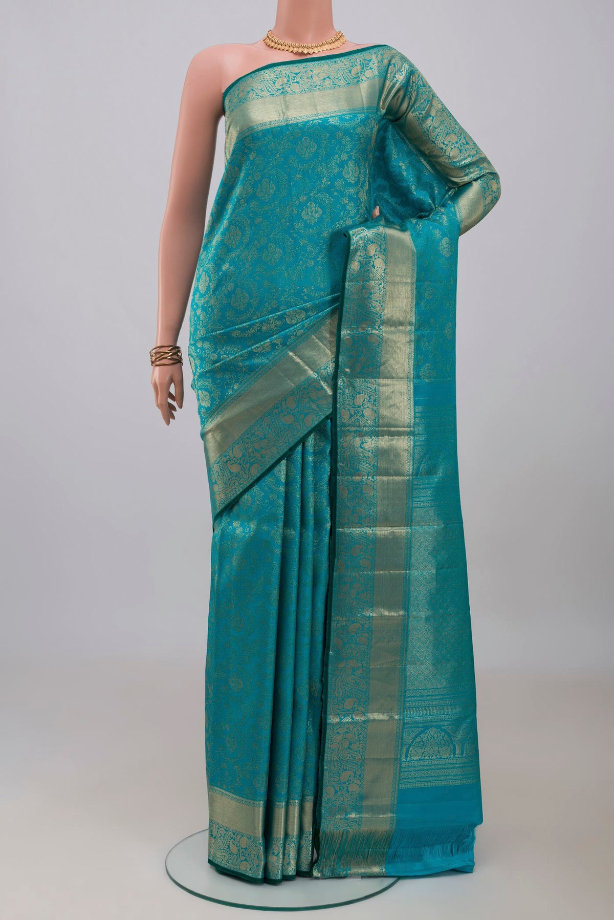 Blue Kanjivaram Silk Saree with Zari Brocade on the body and Zari Border.  displayed on a mannequin