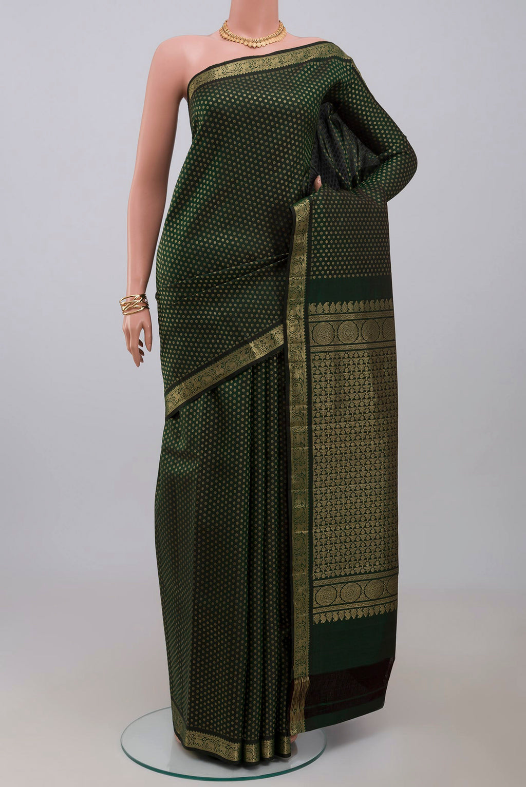 Acid Green Kanjivaram Saree with Zari Butta on the body and Zari Border.  displayed on a mannequin