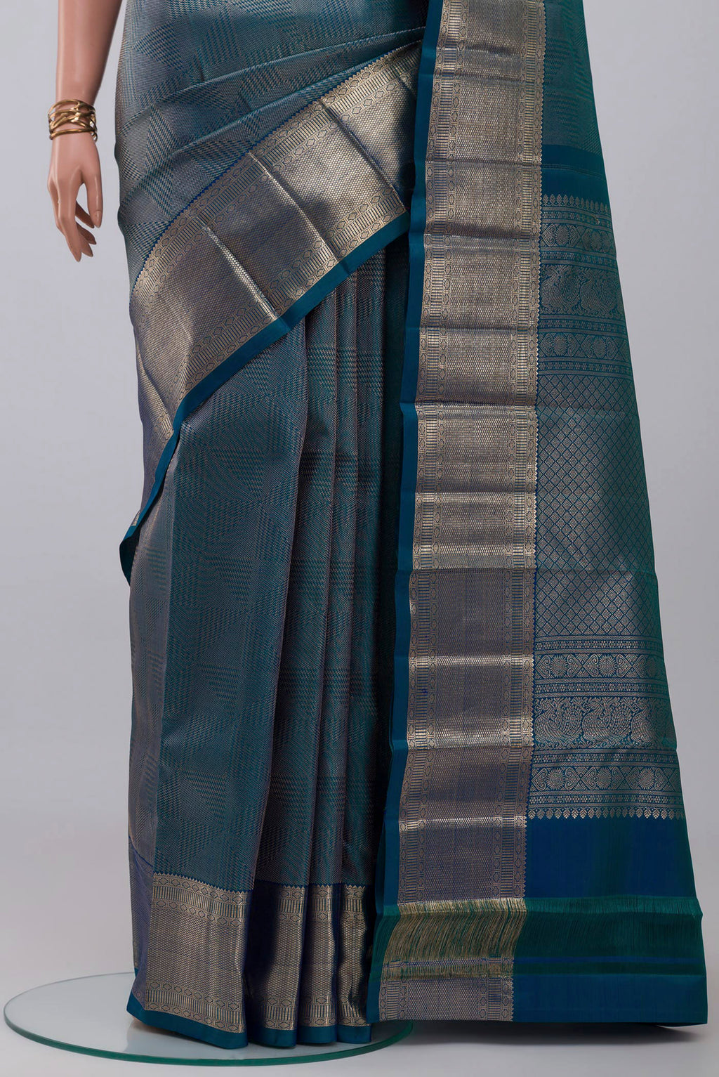 Pleats and pallu of Blue Kanchipuram Silk Saree with Zari Brocade on the body and Zari Border. 