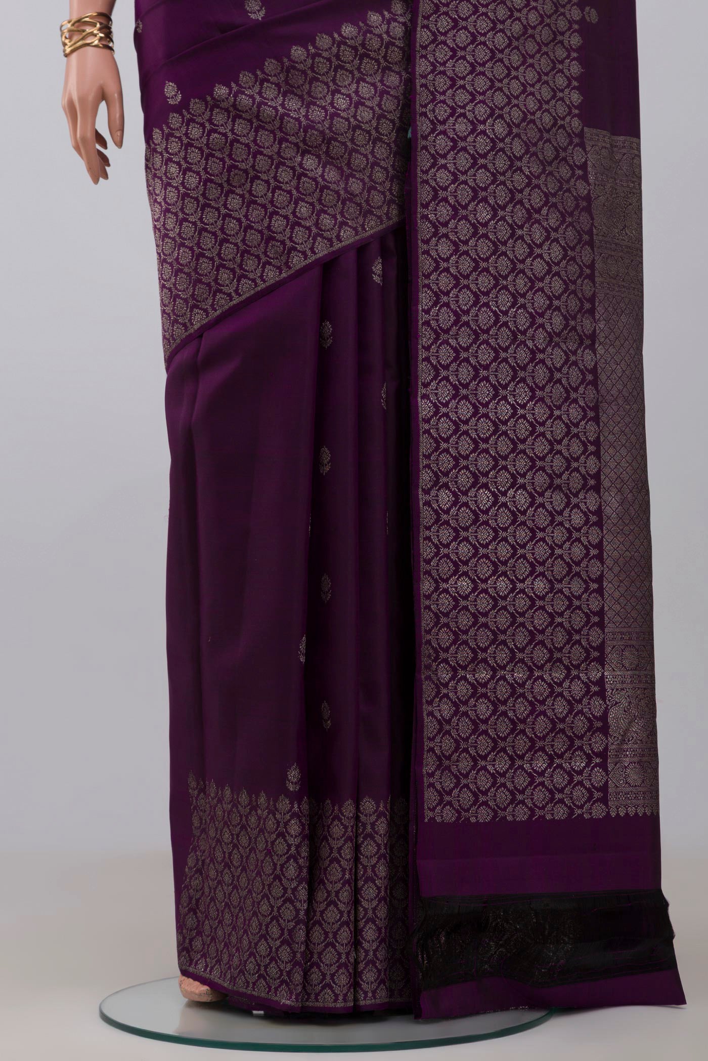 Pleats and pallu of Purple Kanjivaram Silk Saree with Zari Butta on the body and Zari Border. 