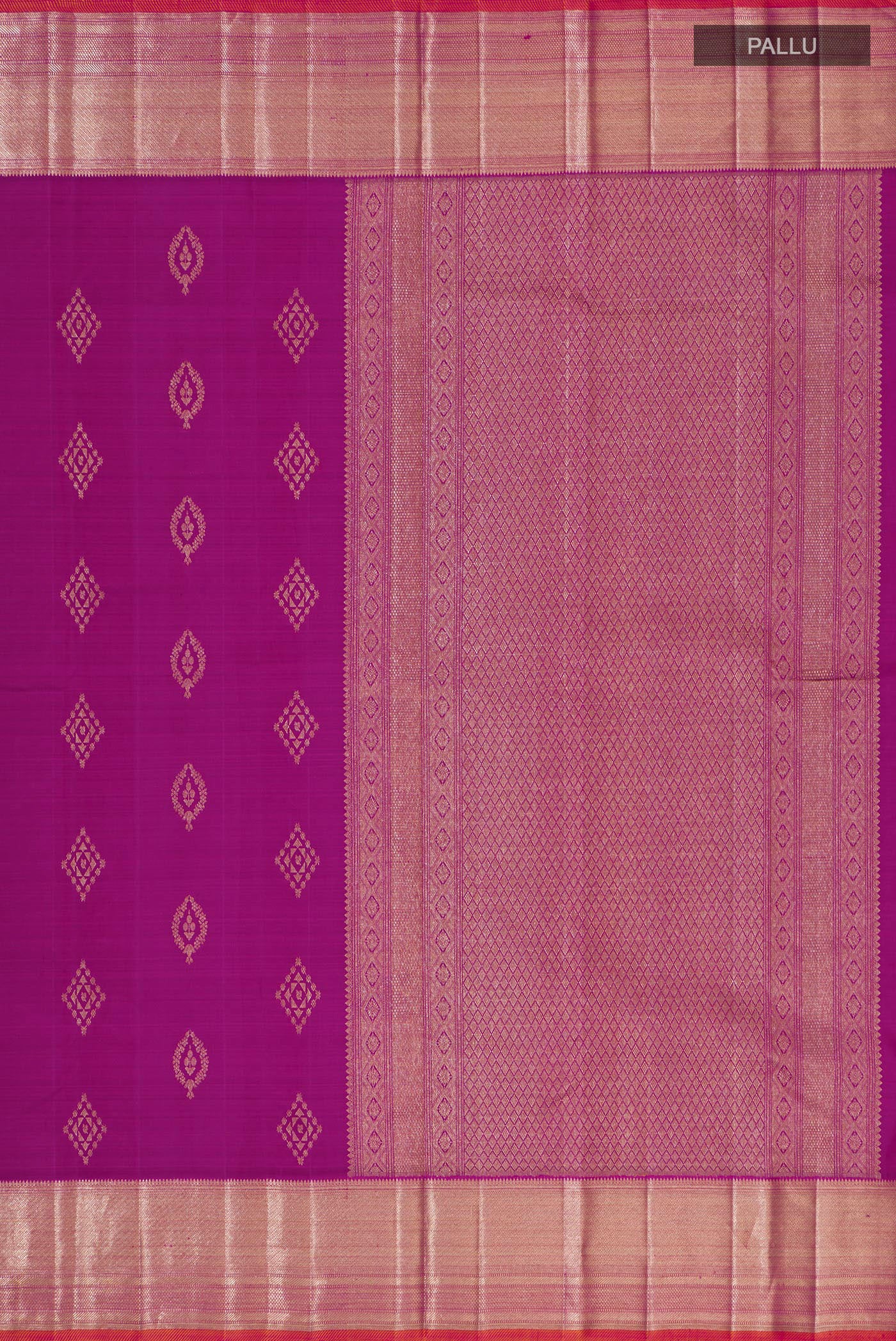 Close up image of the pallu of Magenta Kanjivaram Silk Saree with Zari Butta on the body and Zari Border. 