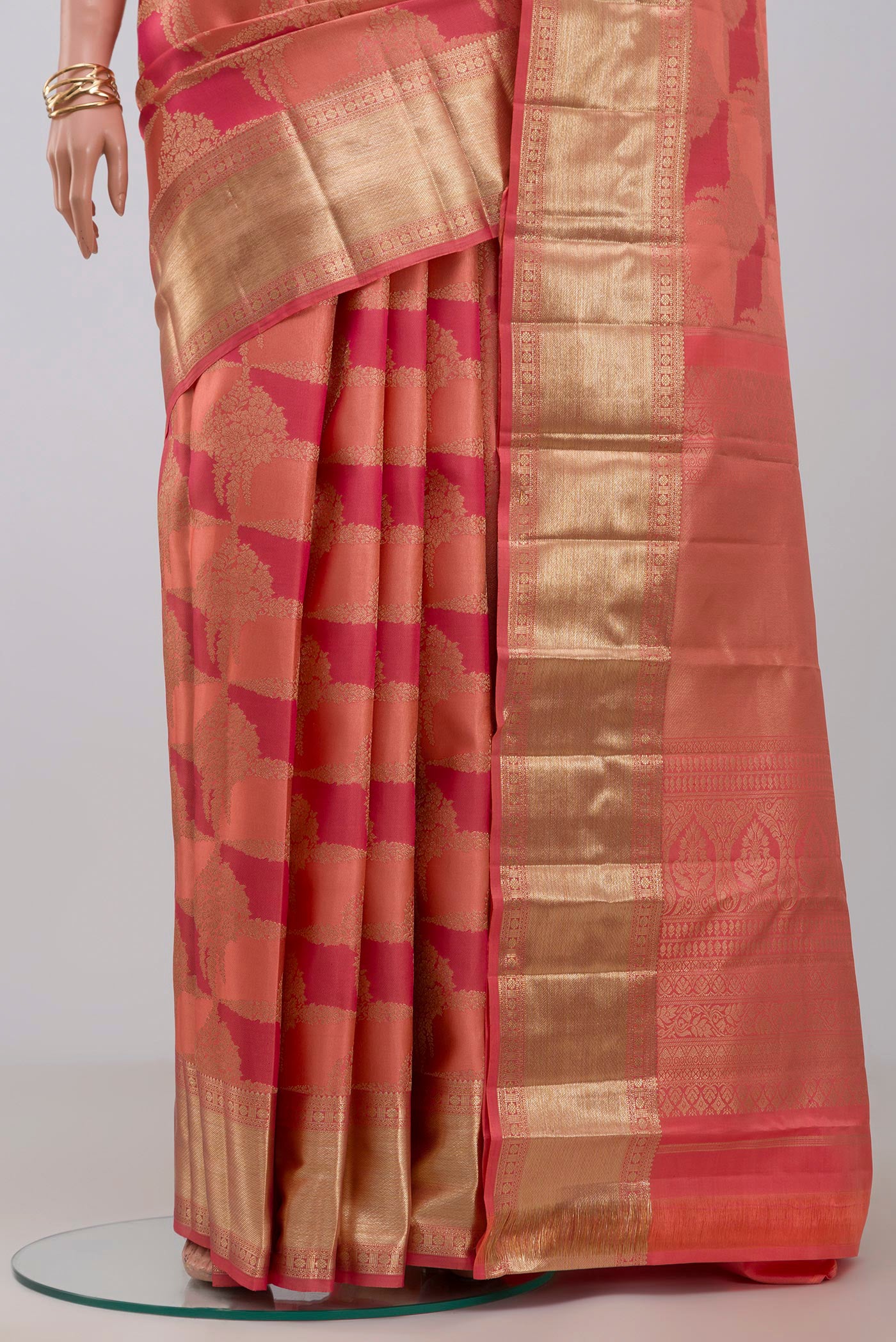 Pleats and pallu of Peach Kanjivaram Silk Saree with Zari Brocade on the body and Zari Border. 