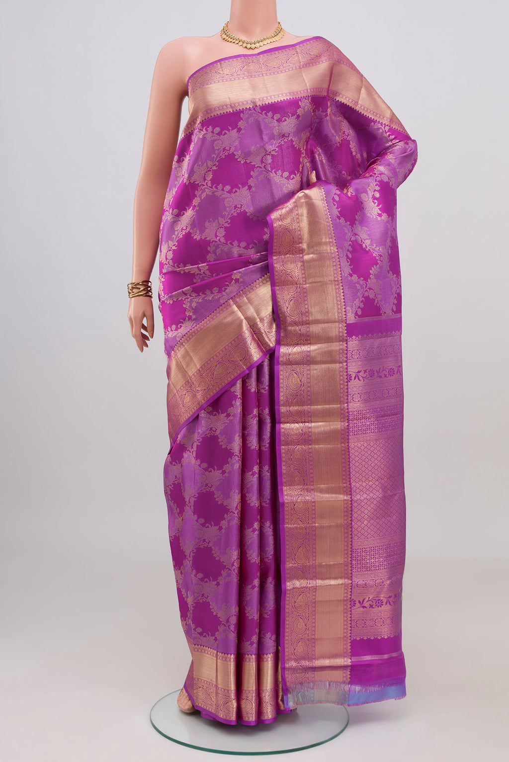 Purple Kanjivaram Silk Saree with Zari Brocade on the body and Zari Border.  displayed on a mannequin