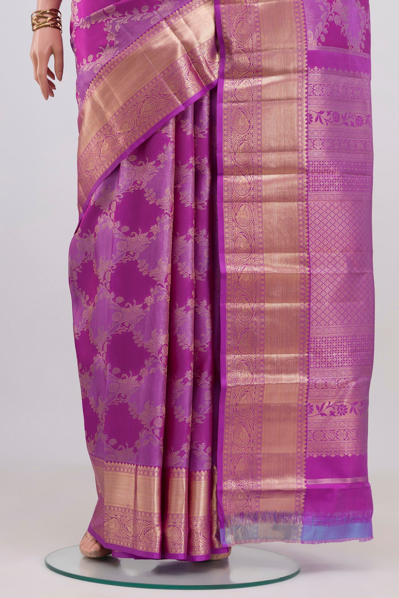 Pleats and pallu of Purple Kanjivaram Silk Saree with Zari Brocade on the body and Zari Border. 