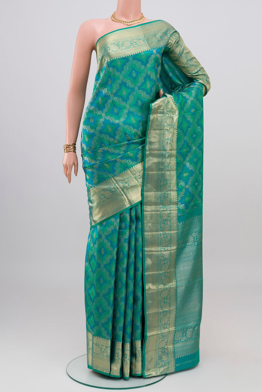 Blue Dual Tone Kanjivaram Silk Saree with Zari Brocade on the body and Zari Border.  displayed on a mannequin