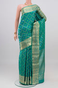 Blue Dual Tone Kanjivaram Silk Saree with Zari Brocade on the body and Zari Border.  displayed on a mannequin