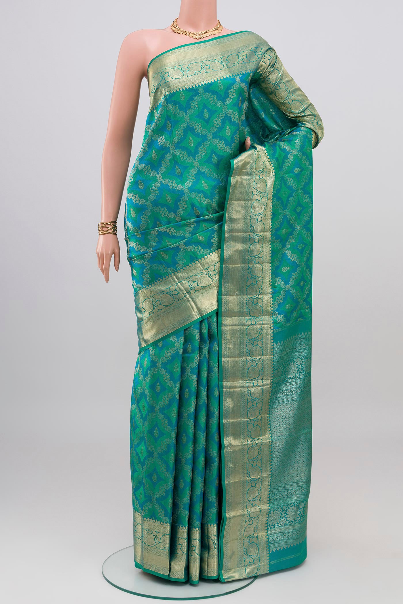 Blue Dual Tone Kanjivaram Silk Saree with Zari Brocade on the body and Zari Border.  displayed on a mannequin