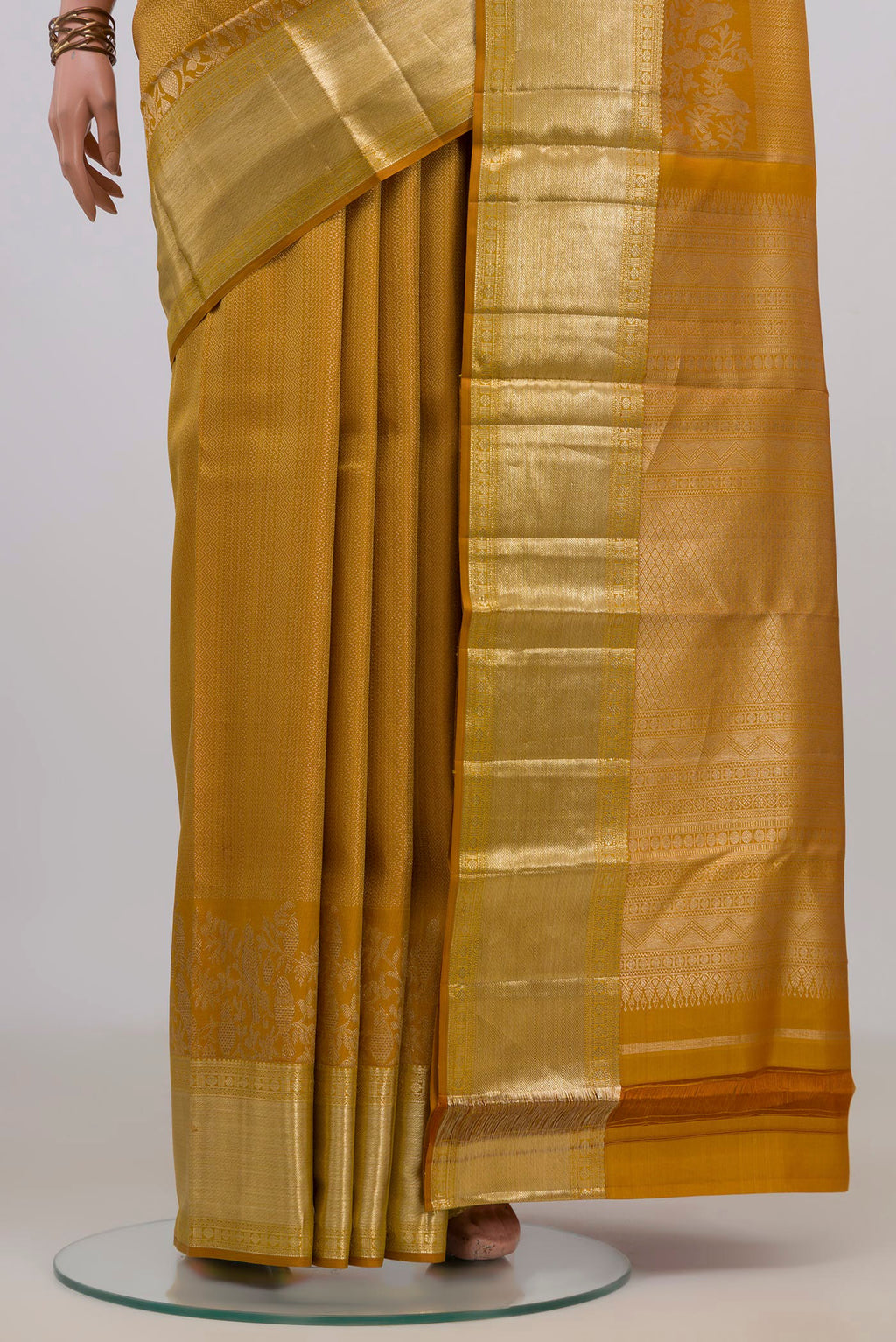 Pleats and pallu of Pure Silk Mustard Kanjivaram Saree with Zari Brocade on the body and Zari Border. 