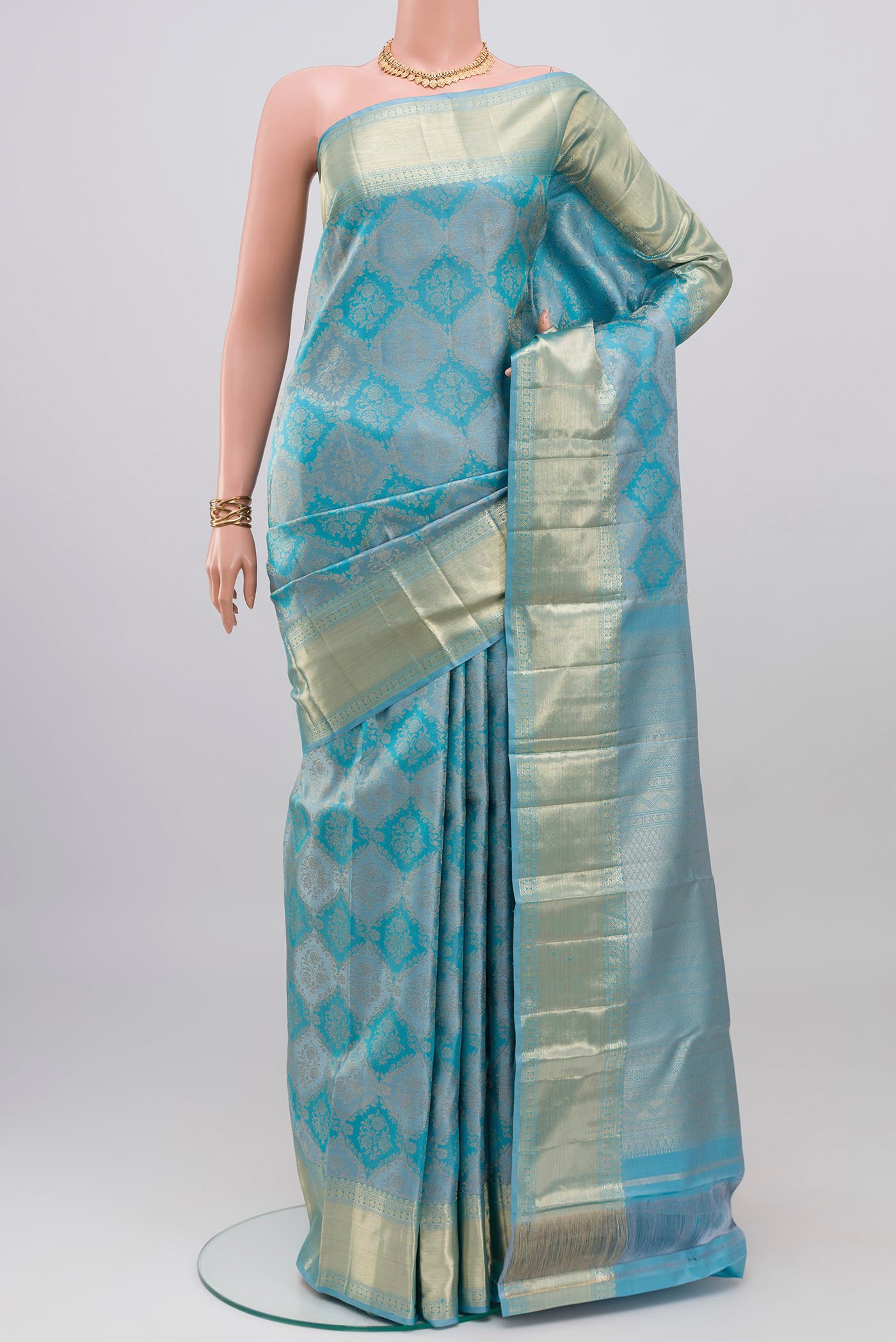 Sky Blue Kanjivaram Silk Saree with Zari Brocade on the body and Zari Border.  displayed on a mannequin