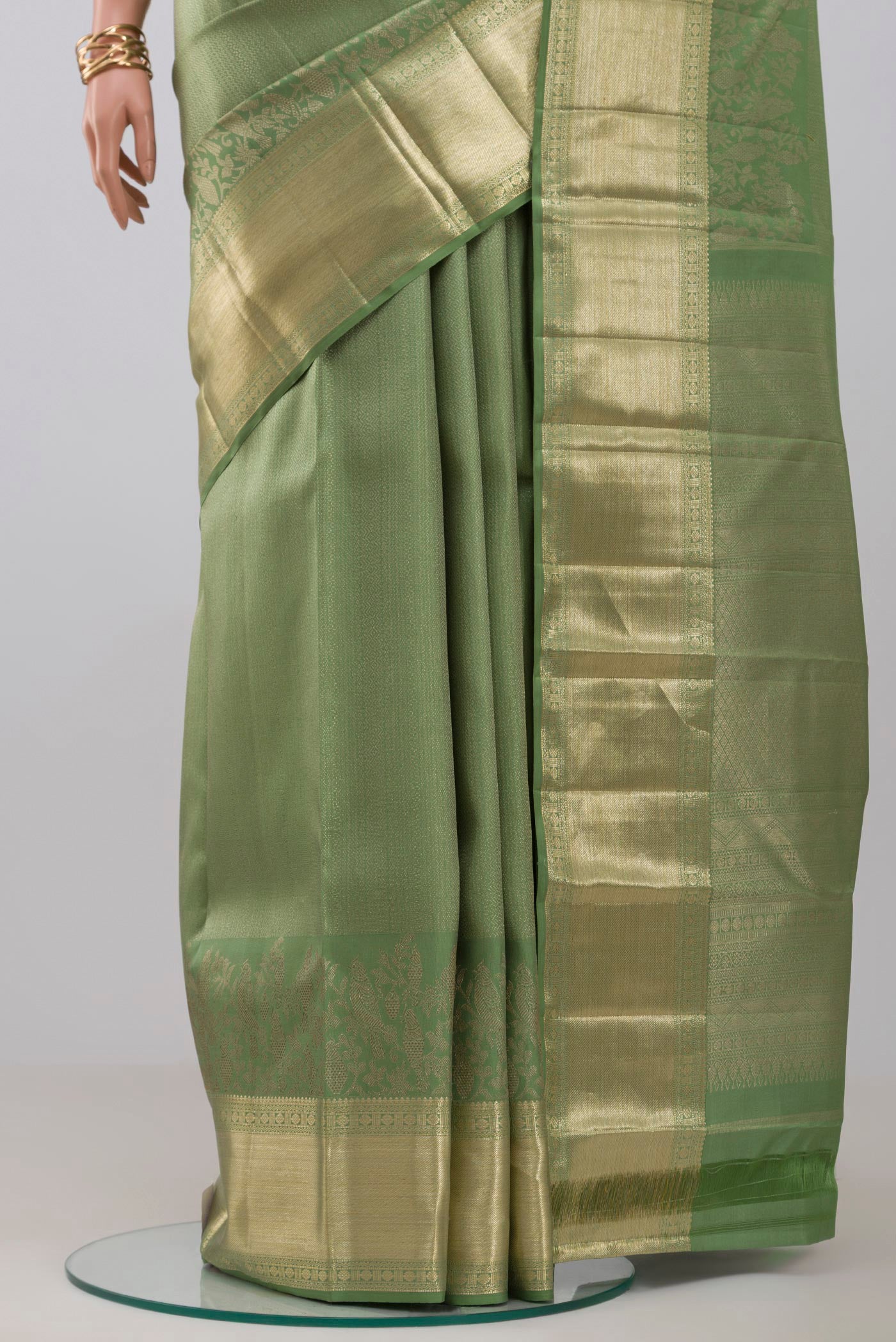 Pleats and pallu of Green Kanjivaram Silk Saree with Zari Brocade on the body and Zari Border. 
