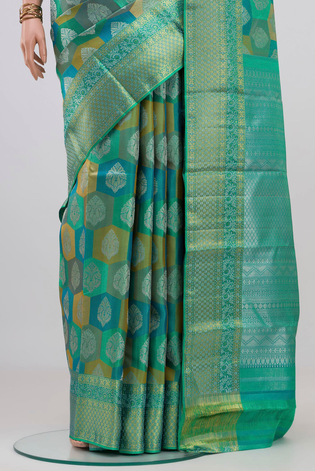 Pleats and pallu of Turquoise Kanjivaram Silk Saree with Zari Brocade on the body and Zari Border. 