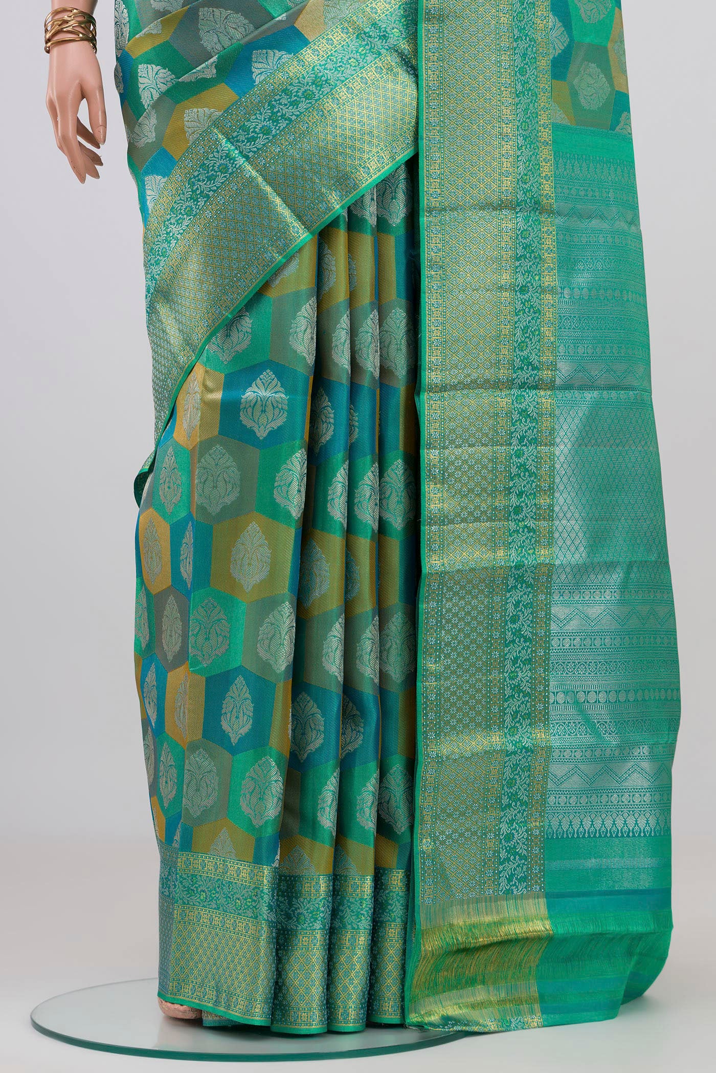 Pleats and pallu of Turquoise Kanjivaram Silk Saree with Zari Brocade on the body and Zari Border. 