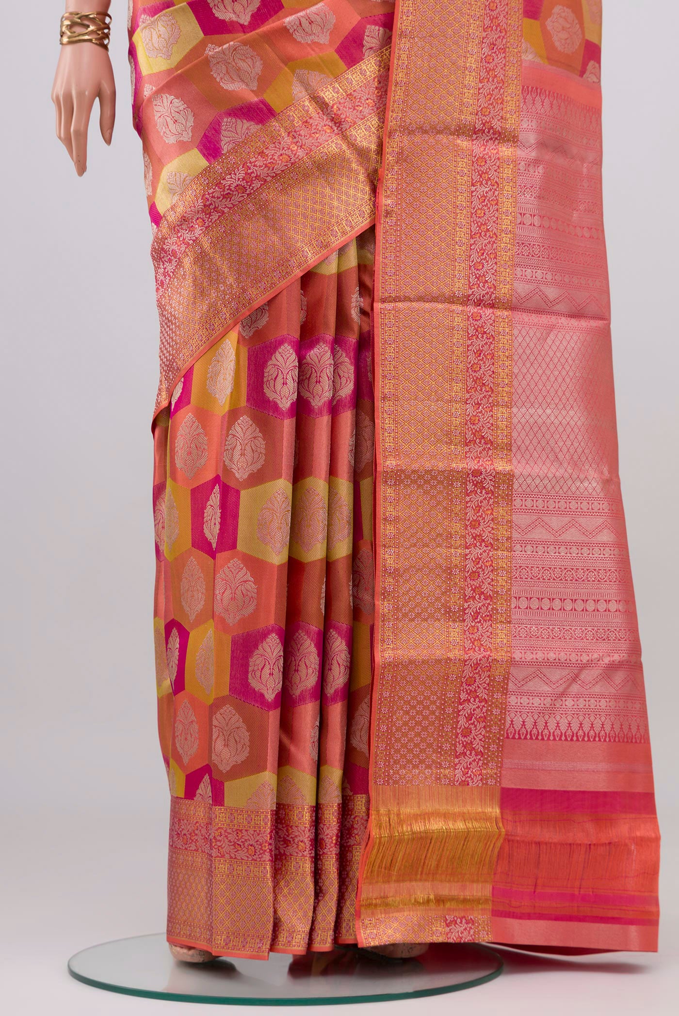 Pleats and pallu of Coral Kanjivaram Silk Saree with Zari Brocade on the body and Zari Border. 