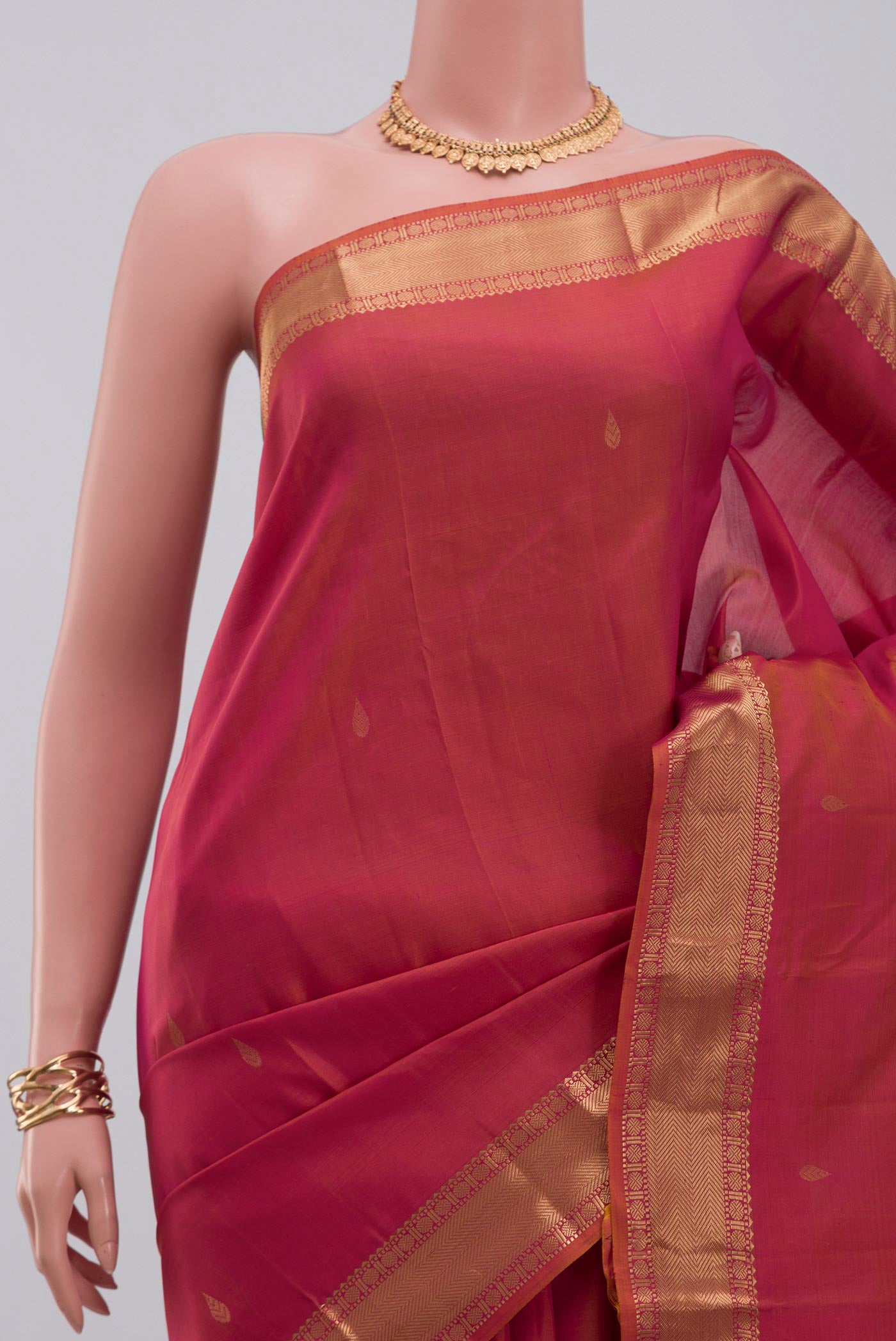 Border image of Orange Kanchipuram Silk Saree with Zari Butta on the body and Zari Border. 