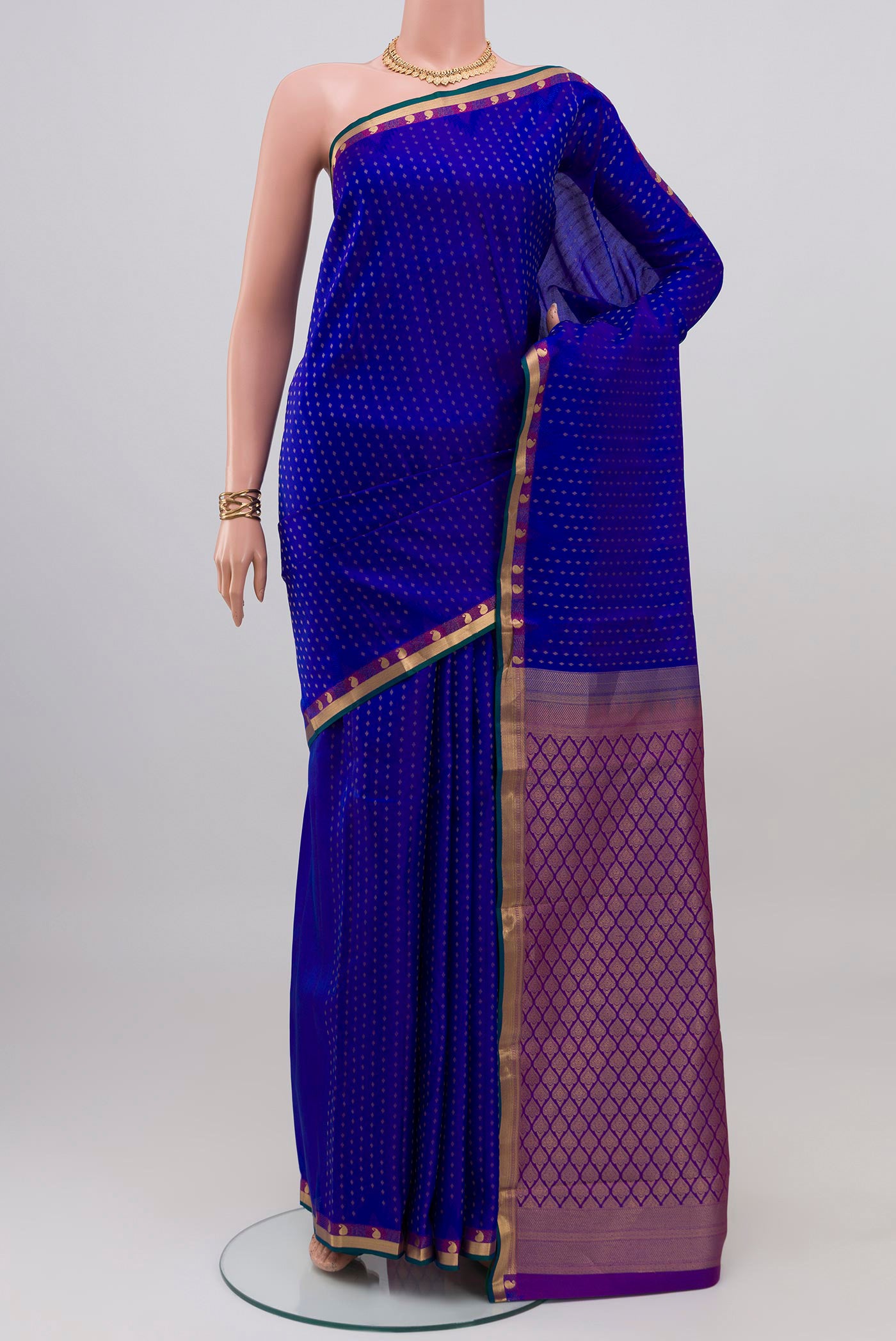 Royal Blue Kanchipuram Silk Saree with Zari Butta on the body and Zari Border.  displayed on a mannequin