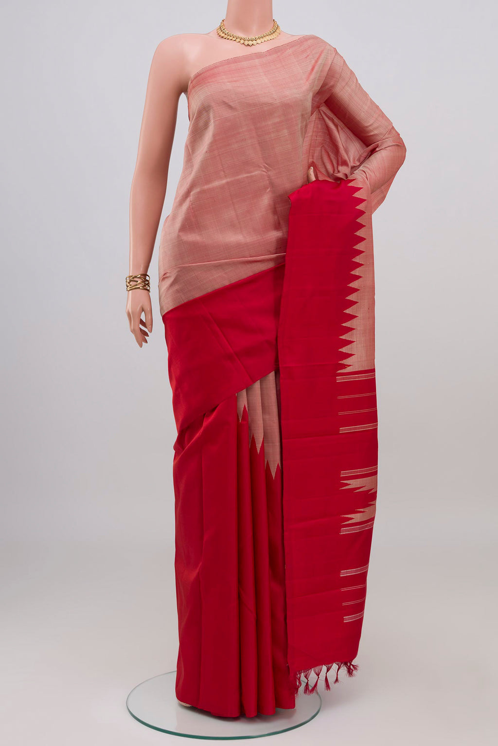 Rose Gold Kanchipuram Silk Saree with Plain Body and Temple Border.  displayed on a mannequin