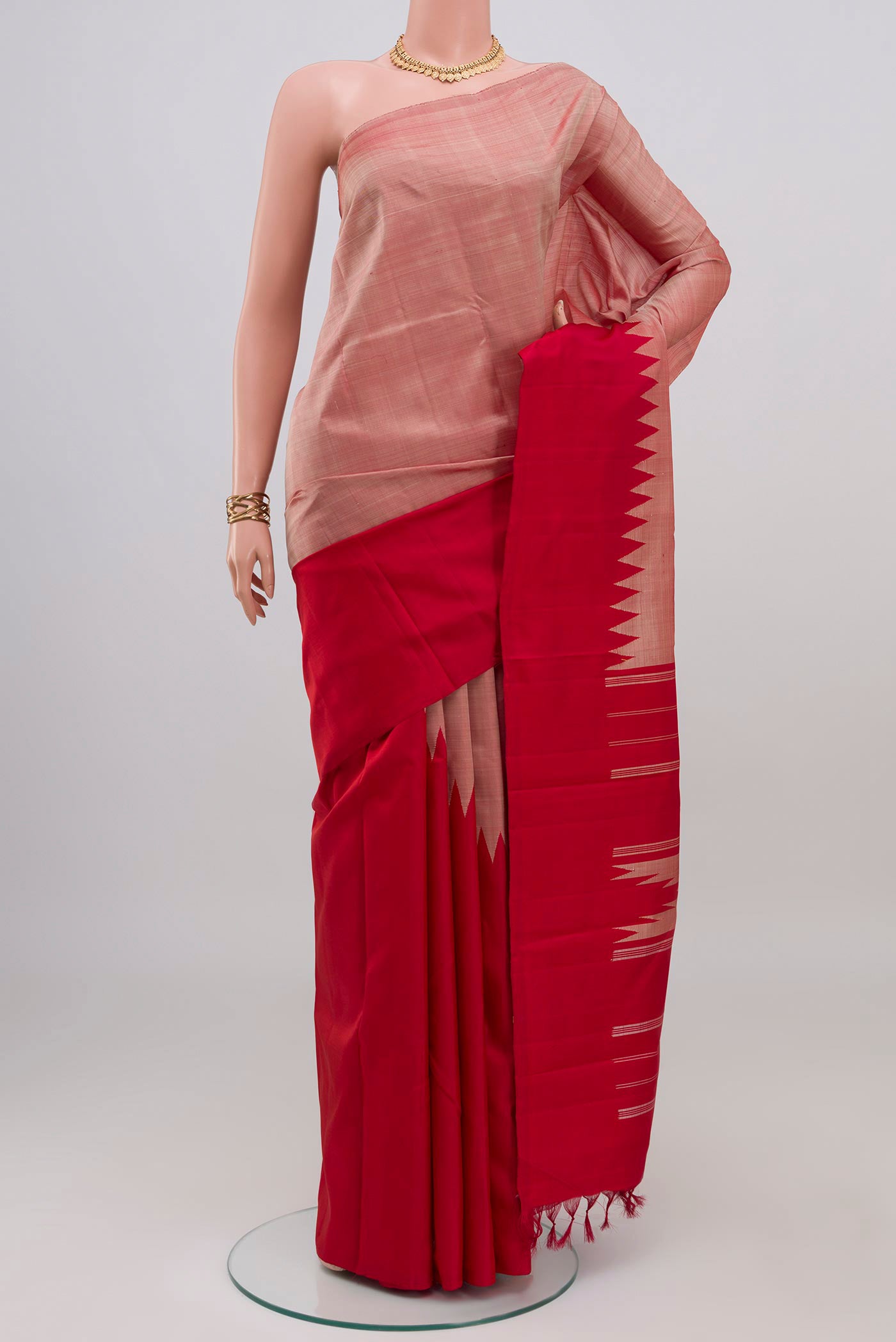 Rose Gold Kanchipuram Silk Saree with Plain Body and Temple Border.  displayed on a mannequin