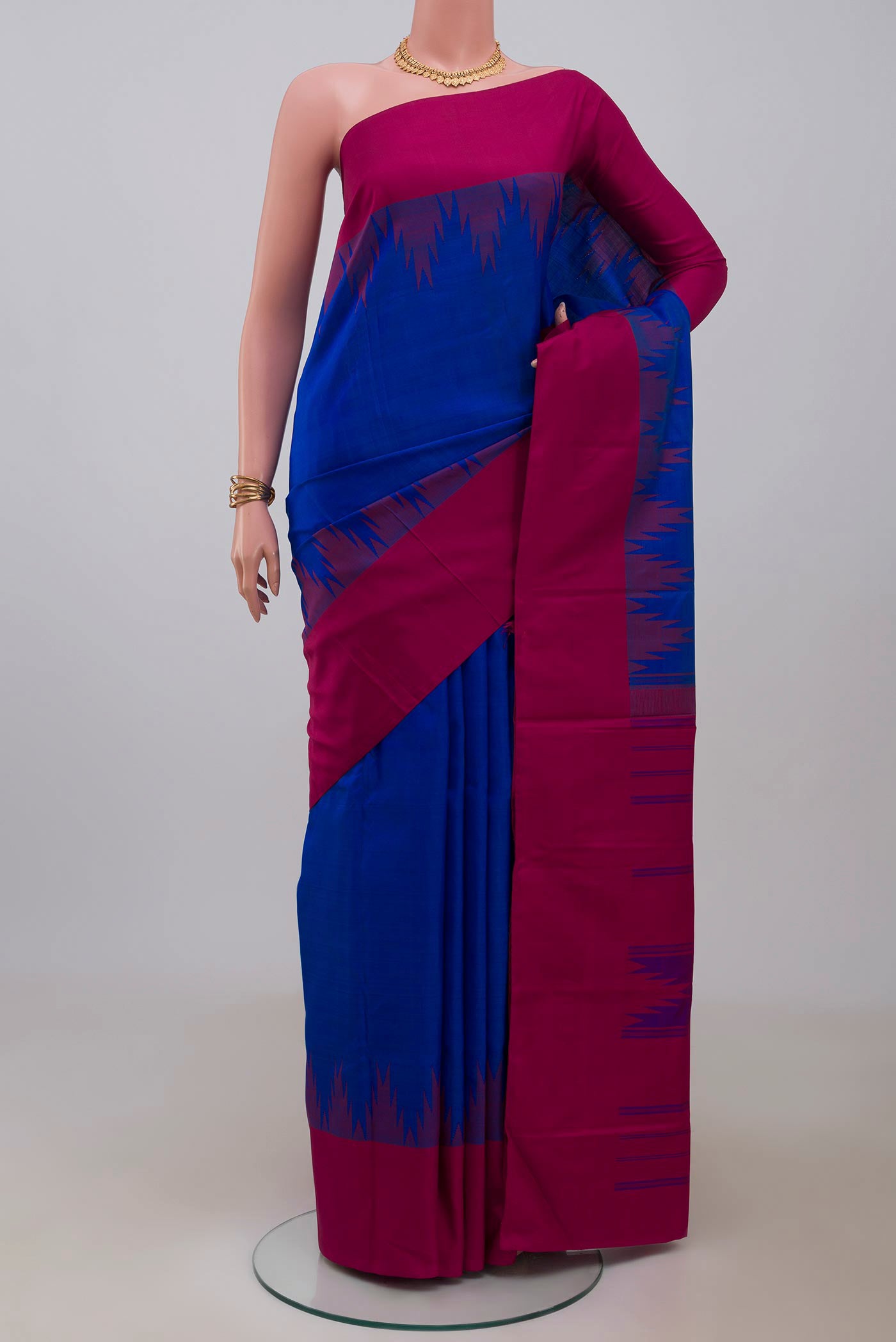 Royal Blue Kanjivaram Silk Saree with Plain Body and Temple Border.  displayed on a mannequin