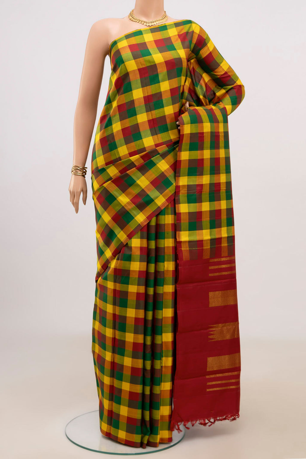 Multi Color Kanchipuram Silk Saree with Checked design on the body and Without Border.  displayed on a mannequin