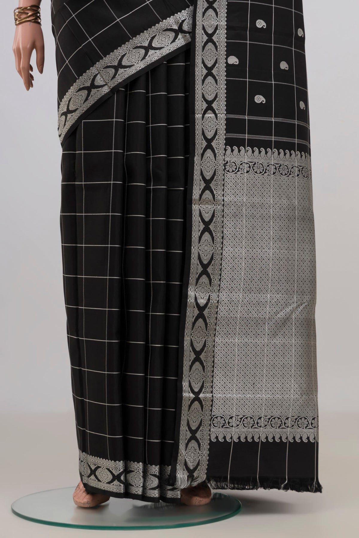 Pleats and pallu of Pure Silk Black Kanjivaram Saree with Checked design on the body and Thread Border. 